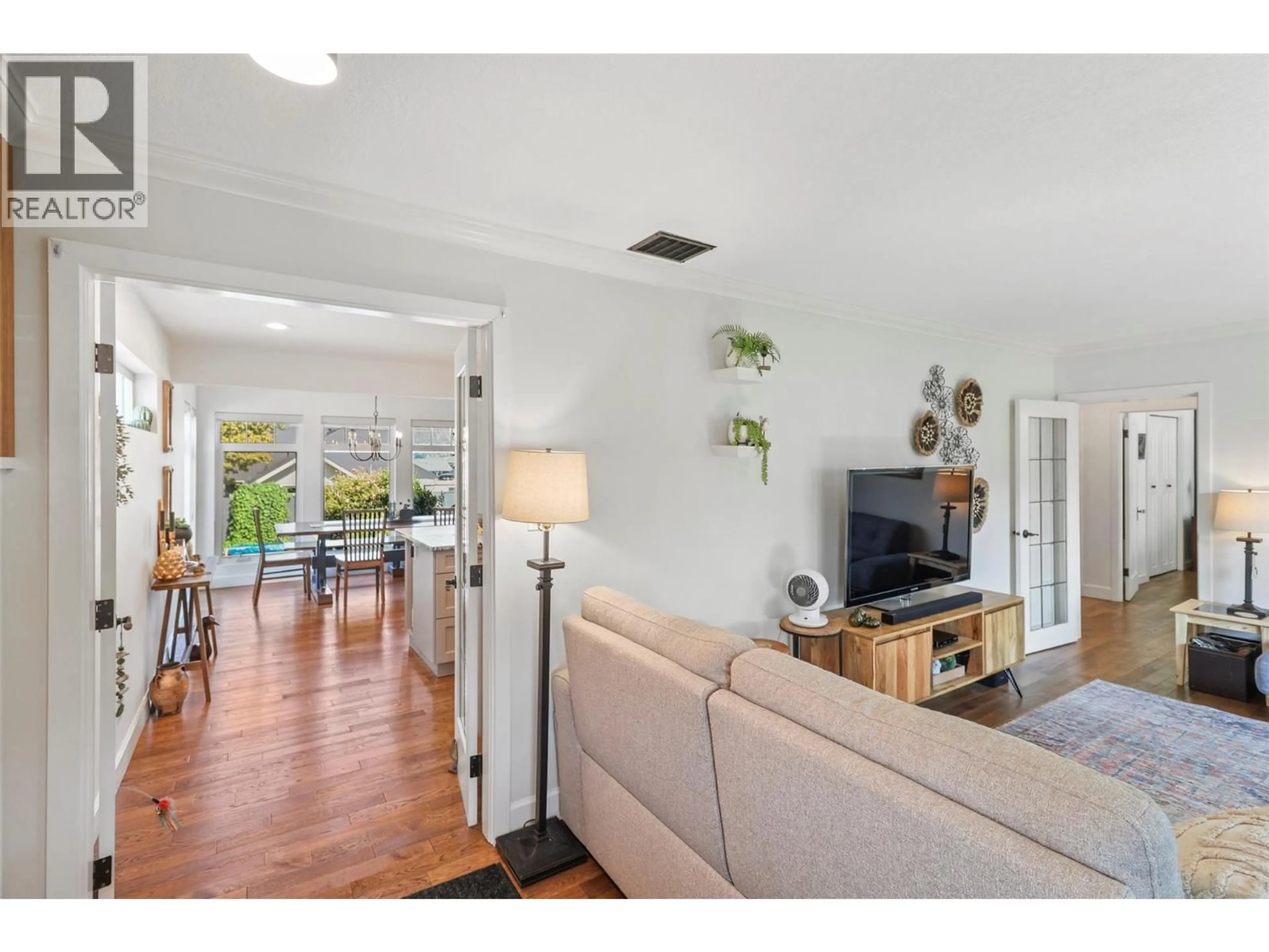 Living room with furniture, wood/laminate floor for 1060 PLEASANT STREET, Kamloops British Columbia V2C3B8