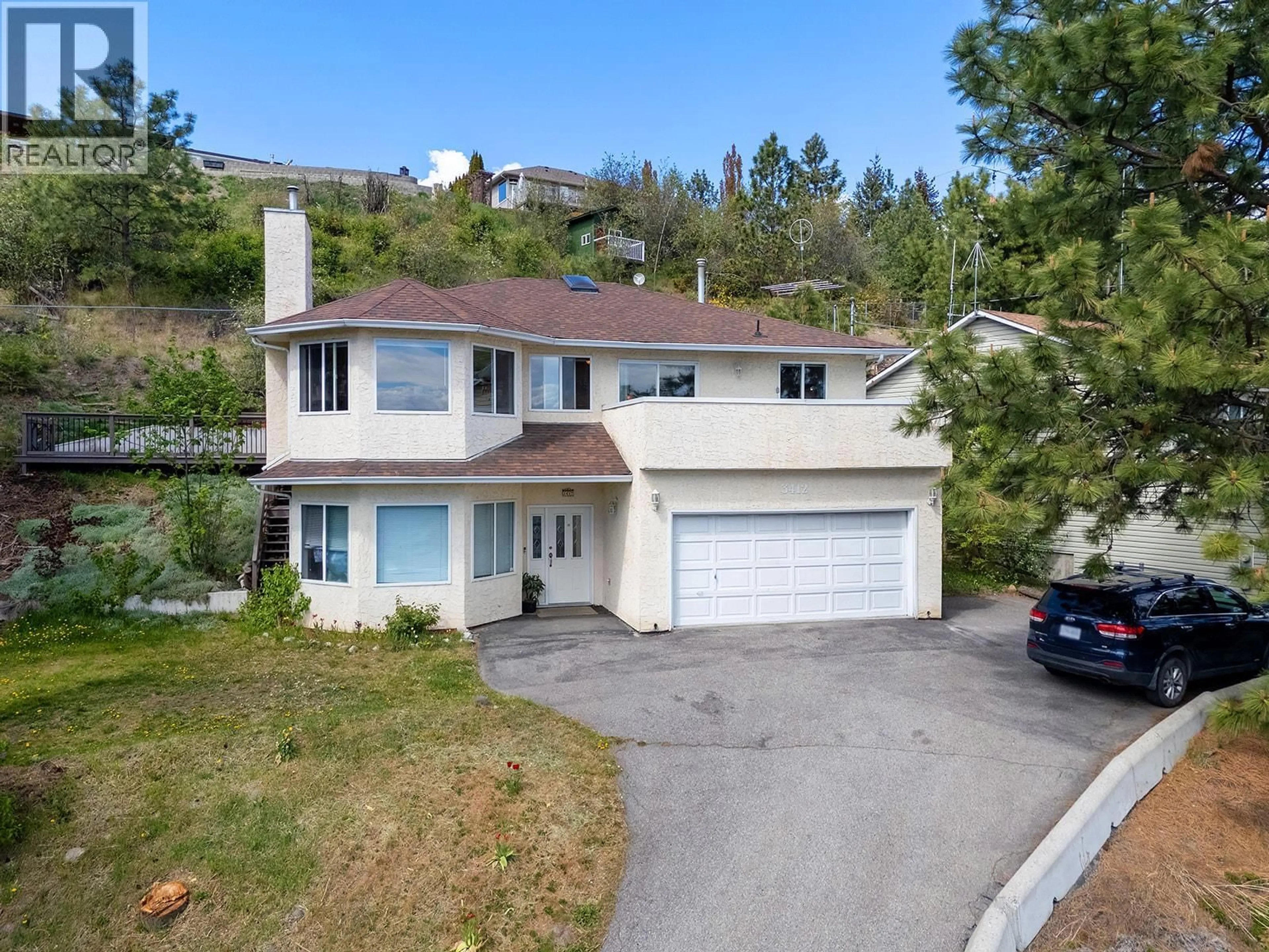 A pic from outside/outdoor area/front of a property/back of a property/a pic from drone, street for 3412 MCIVER ROAD, West Kelowna British Columbia V4T1H7