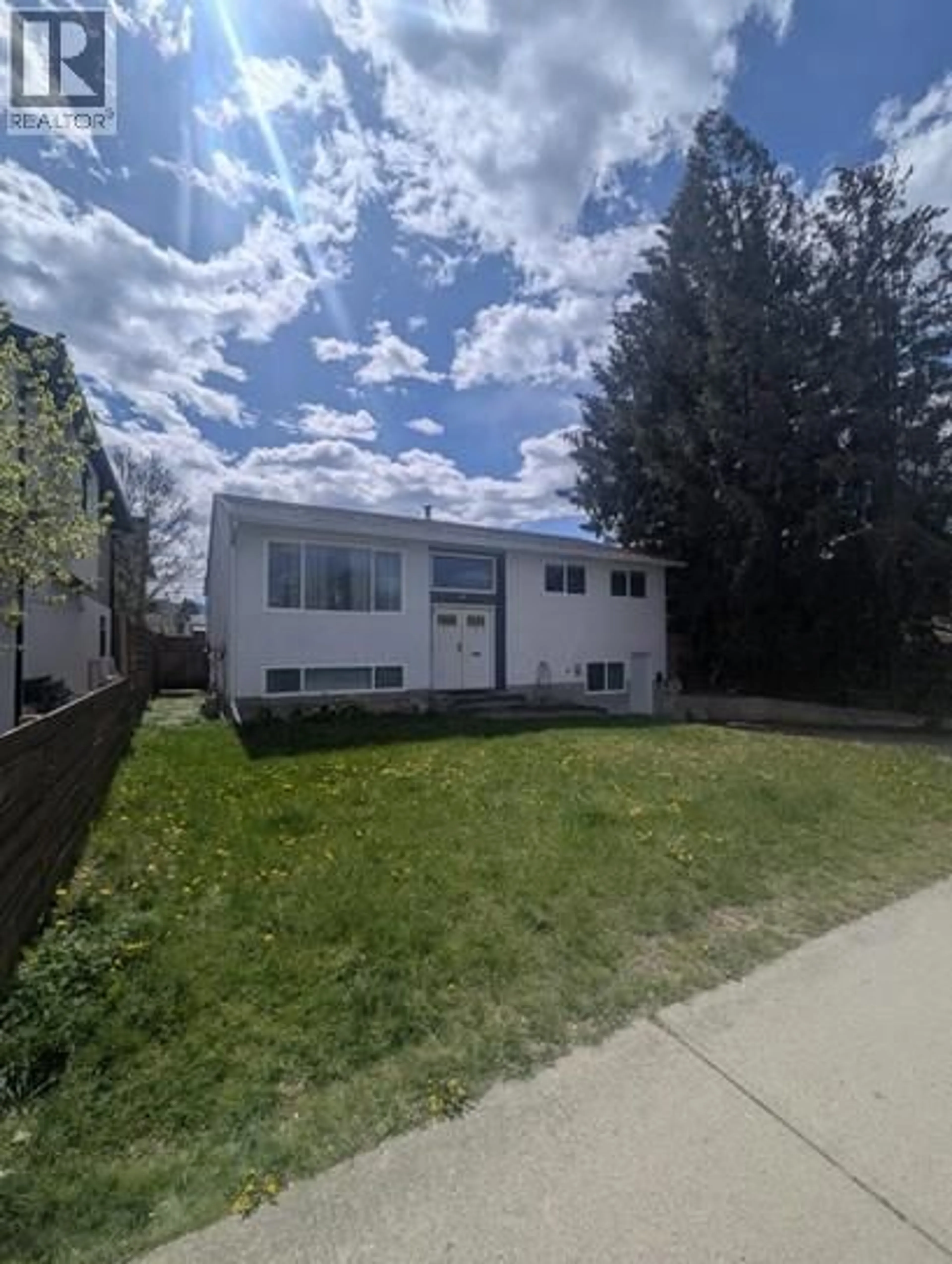 Home with vinyl exterior material, street for 731 RAYMER AVENUE, Kelowna British Columbia V1Y4Z7