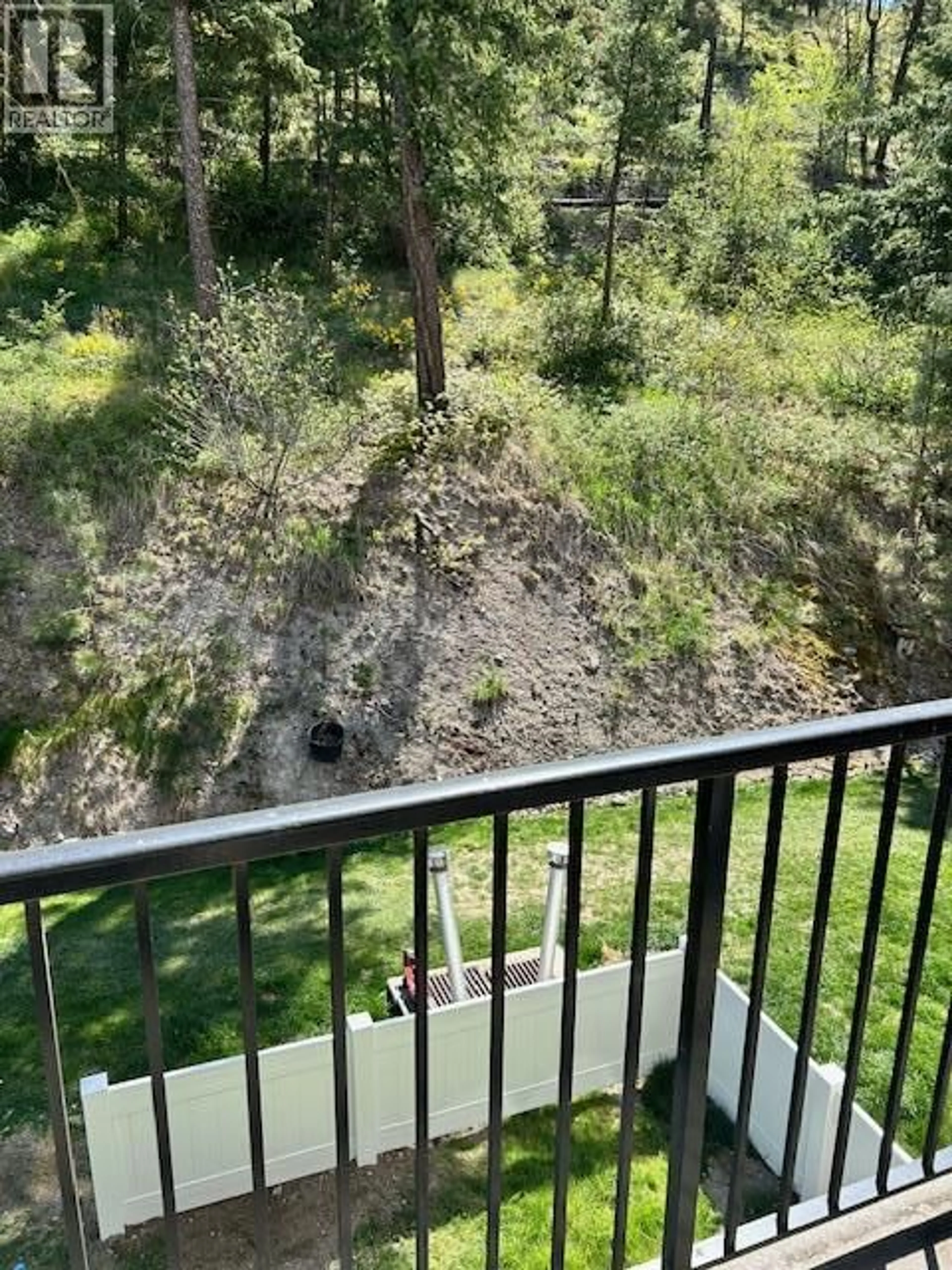Balcony in the apartment, forest/trees view for 308 - 1483 GLENMORE ROAD, Kelowna British Columbia V1V2C5