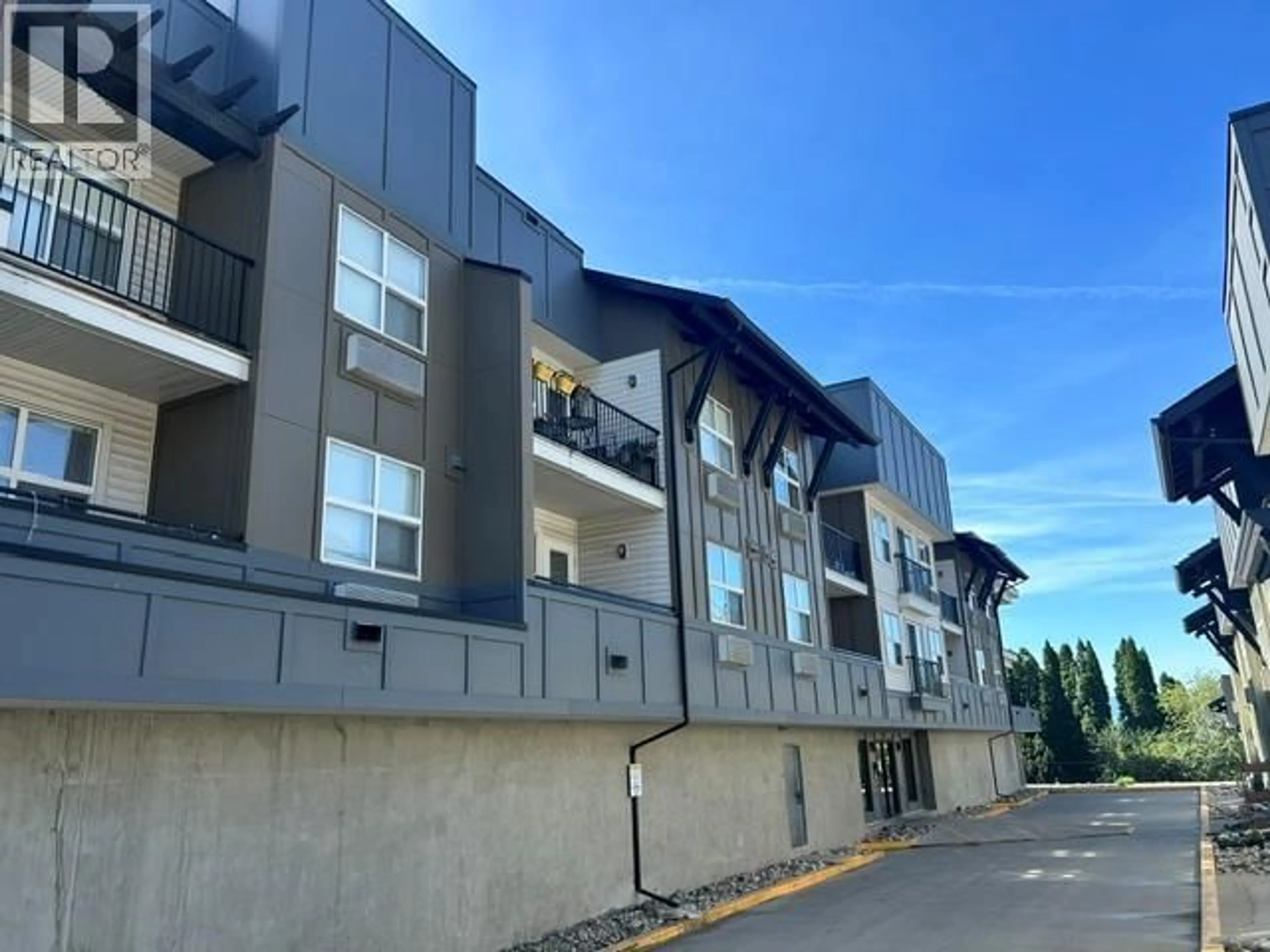 A pic from outside/outdoor area/front of a property/back of a property/a pic from drone, building for 308 - 1483 GLENMORE ROAD, Kelowna British Columbia V1V2C5
