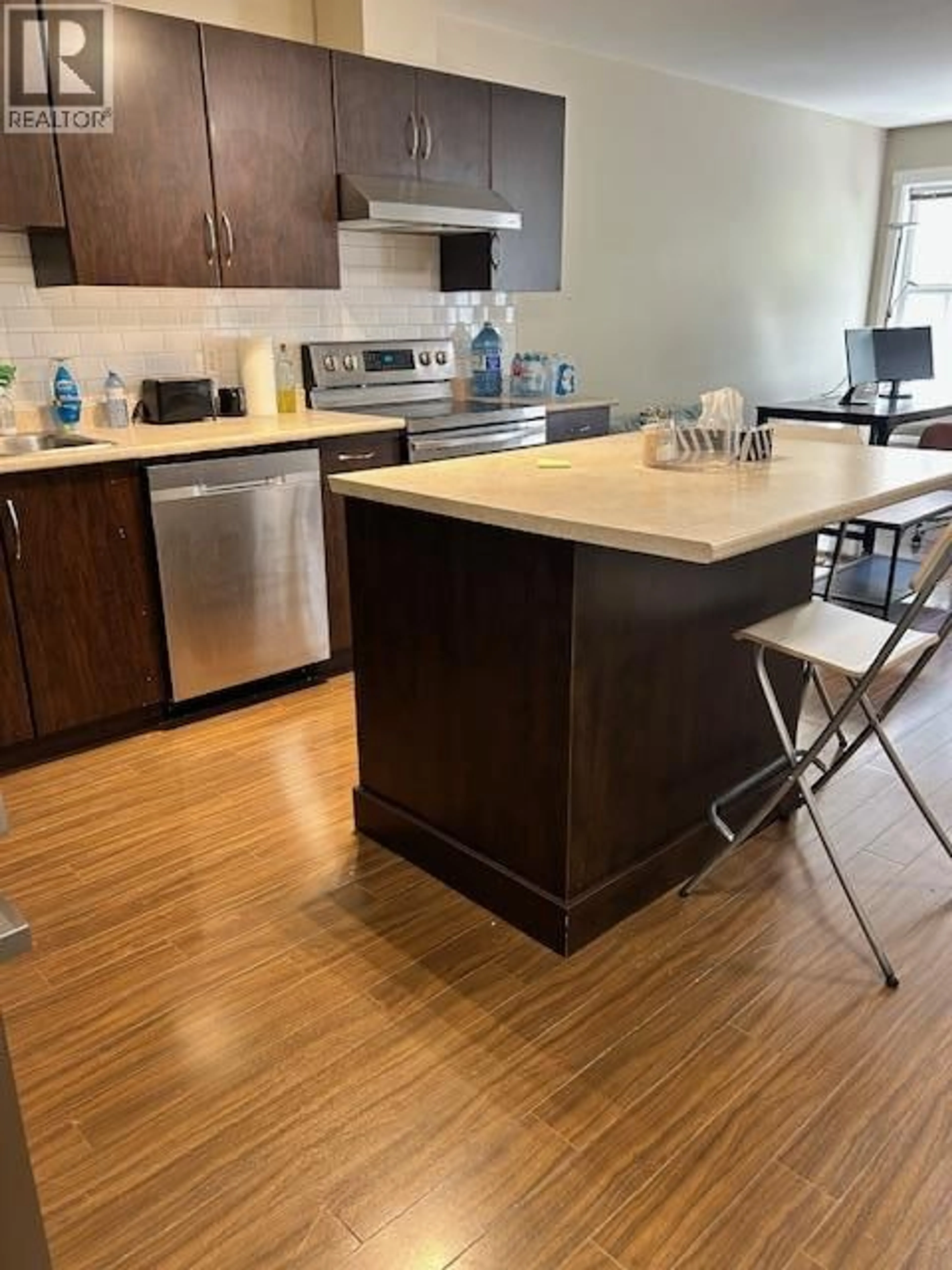 Open concept kitchen, wood/laminate floor for 308 - 1483 GLENMORE ROAD, Kelowna British Columbia V1V2C5