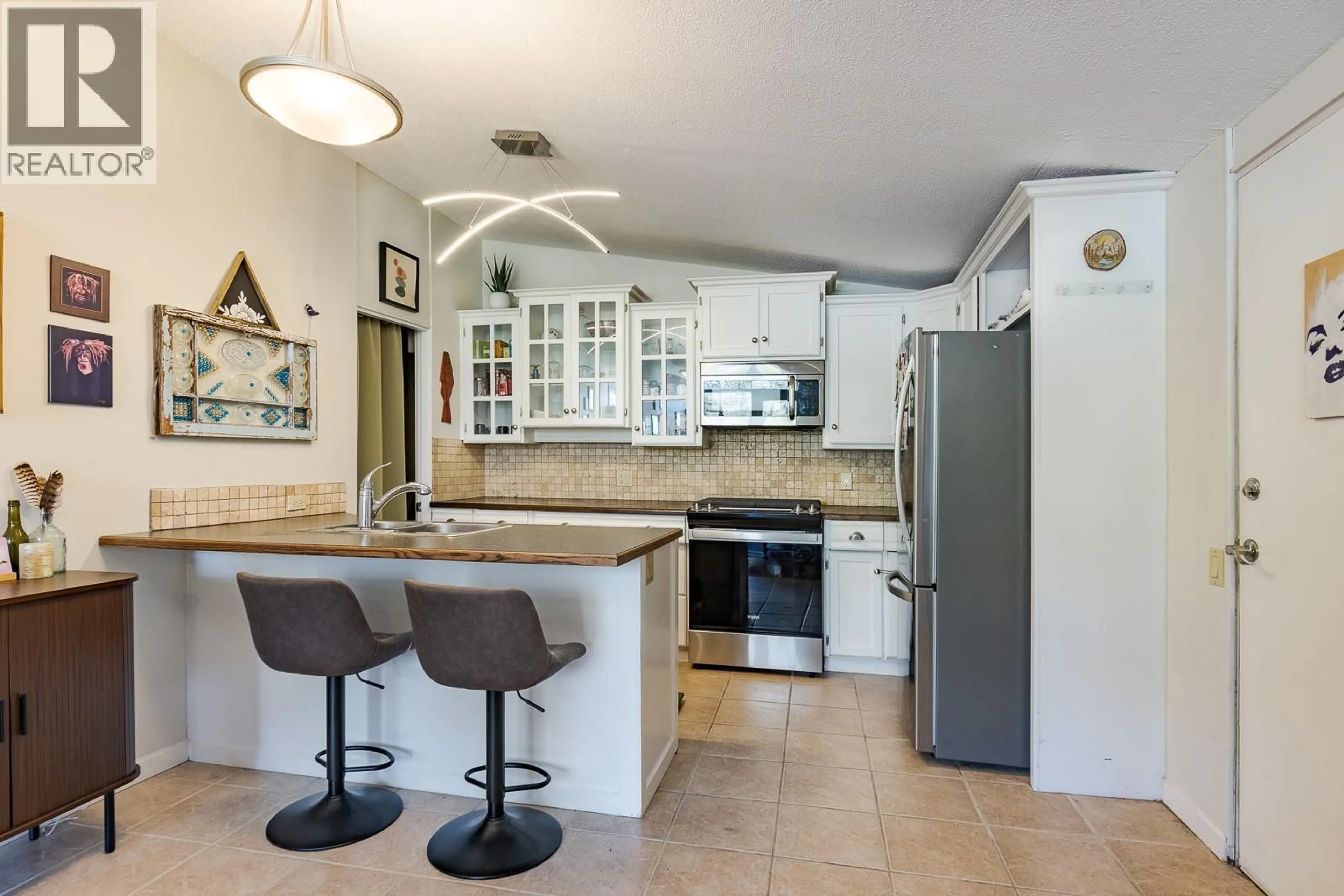 Open concept kitchen, ceramic/tile floor for 11 - 353 BOYCE CRESCENT, Kelowna British Columbia V1Y5Z7