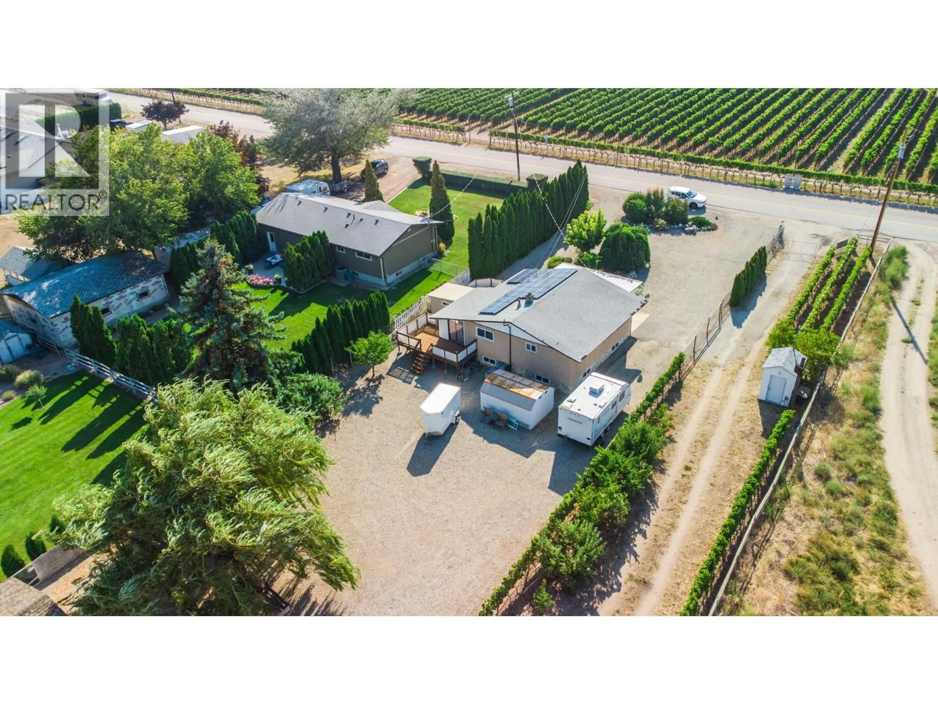A pic from outside/outdoor area/front of a property/back of a property/a pic from drone, street for 156 SECREST HILL ROAD, Oliver British Columbia V0H1T5