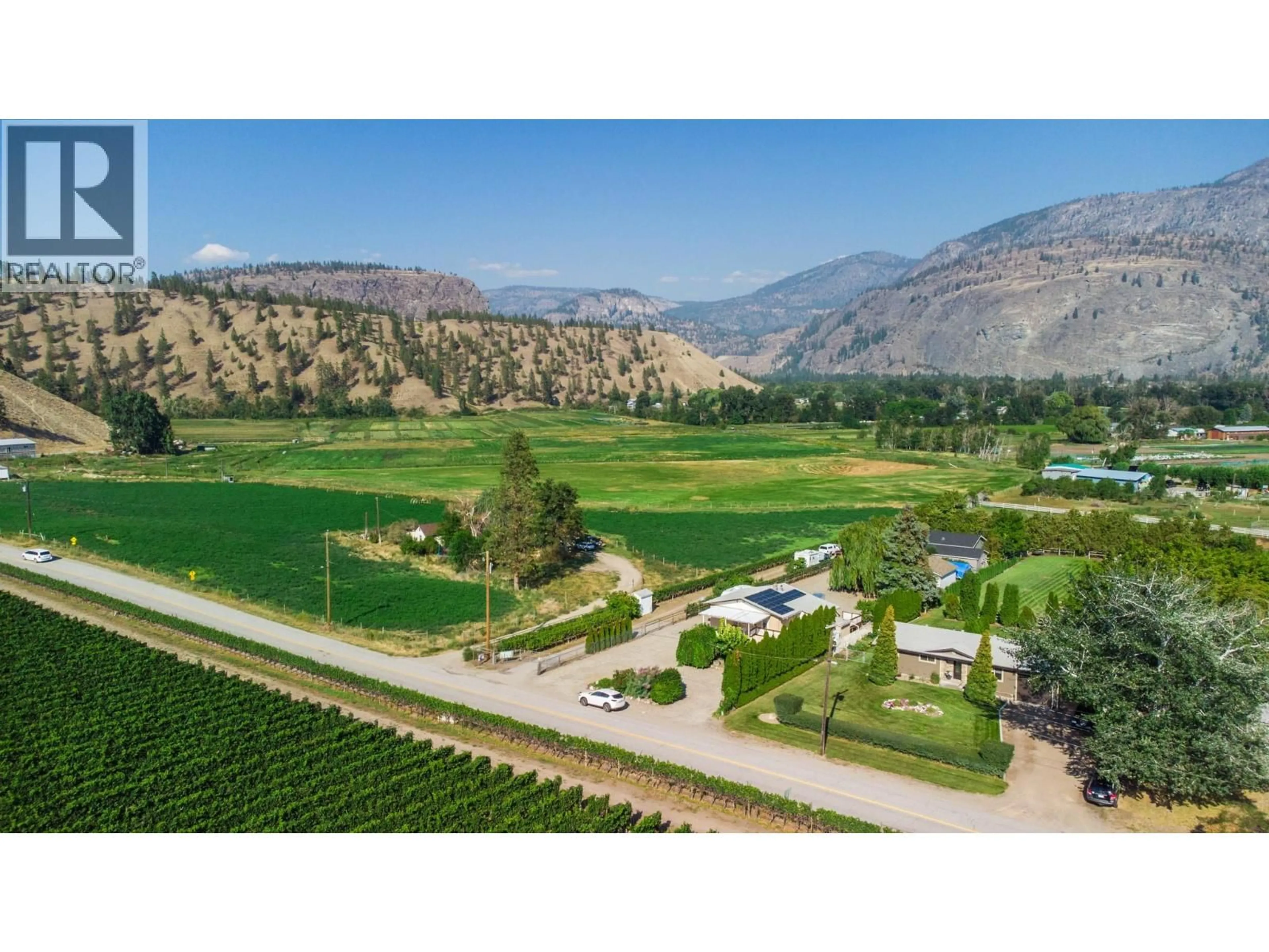 A pic from outside/outdoor area/front of a property/back of a property/a pic from drone, mountain view for 156 SECREST HILL ROAD, Oliver British Columbia V0H1T5