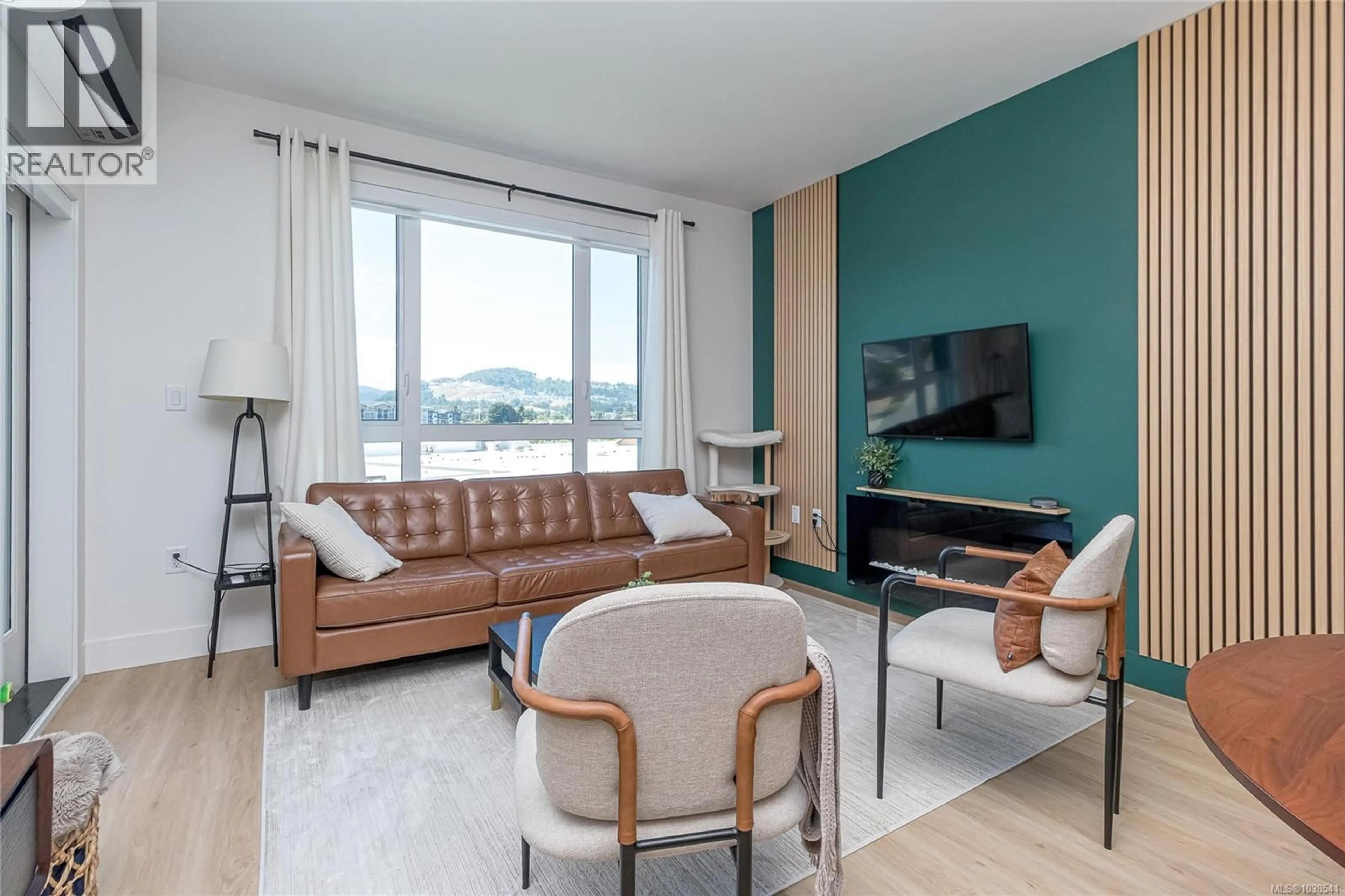 Living room with furniture, wood/laminate floor for 440 - 920 REUNION AVENUE, Langford British Columbia V9B0W8