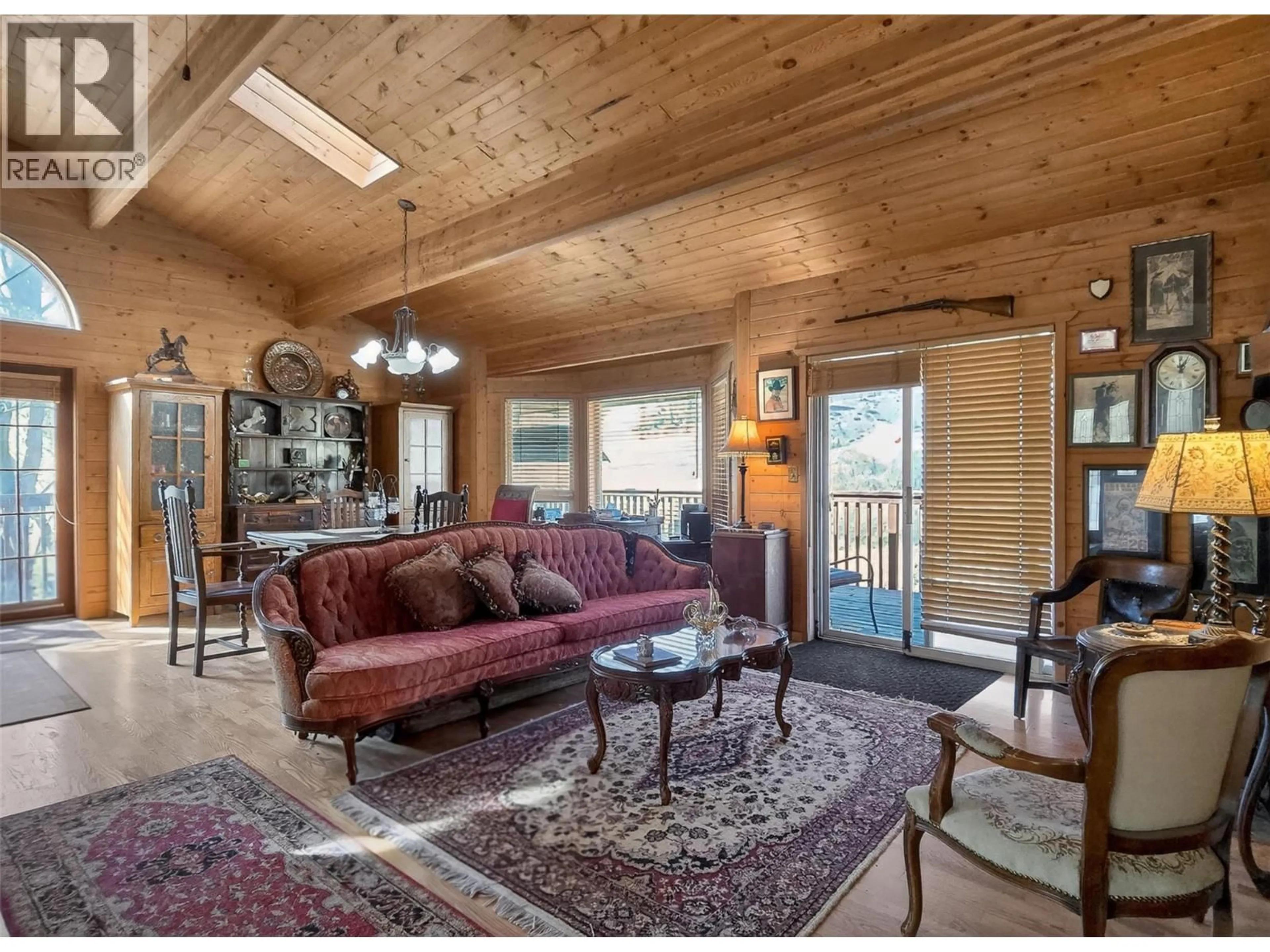 Living room with furniture, wood/laminate floor for 4189 MICKEY FRONTAGE ROAD, Cache Creek British Columbia V0K1H1