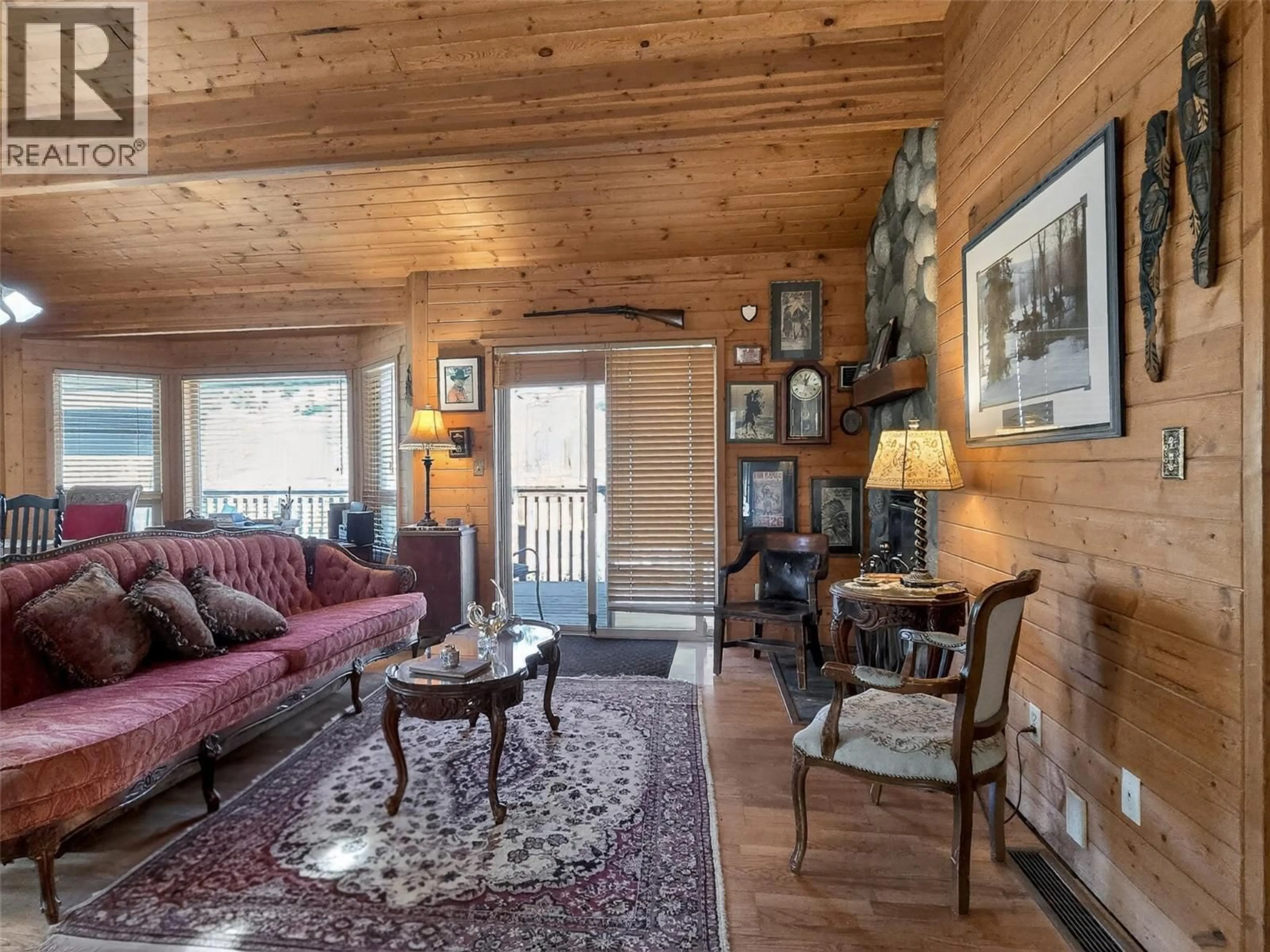 Living room with furniture, wood/laminate floor for 4189 MICKEY FRONTAGE ROAD, Cache Creek British Columbia V0K1H1