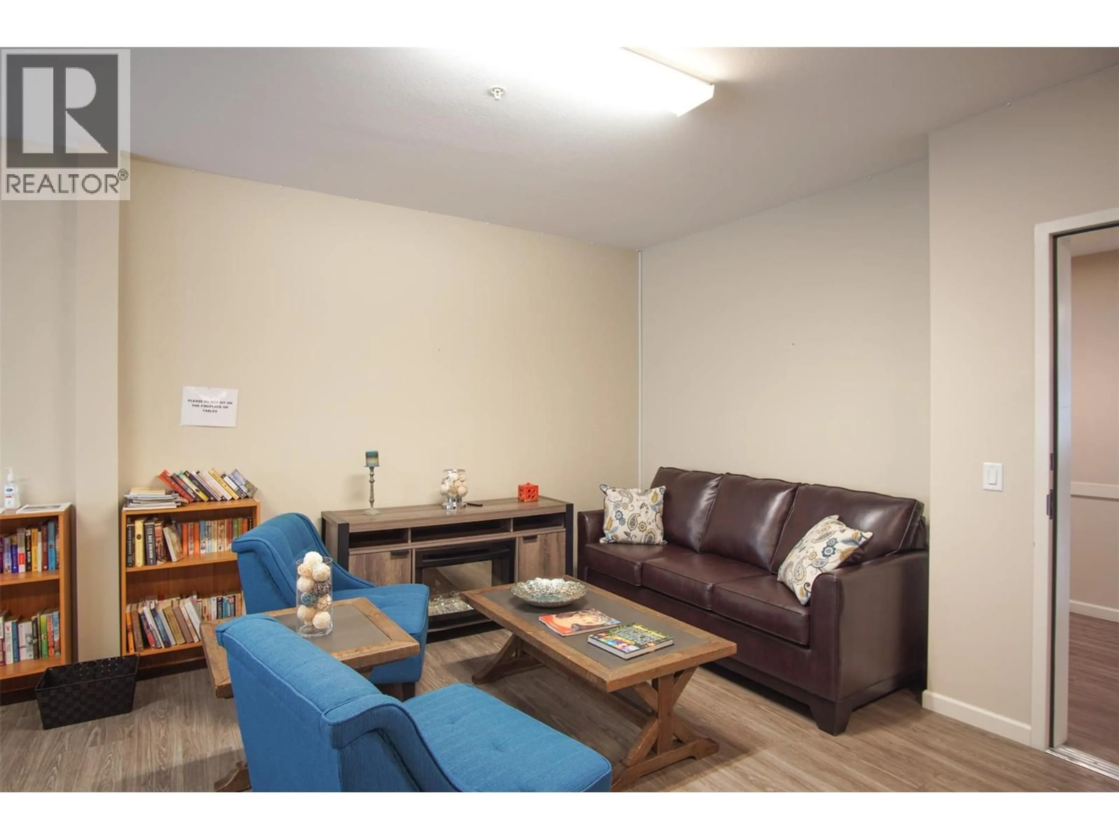 Living room with furniture, wood/laminate floor for 209 - 3010 35 STREET, Vernon British Columbia V1T0A7