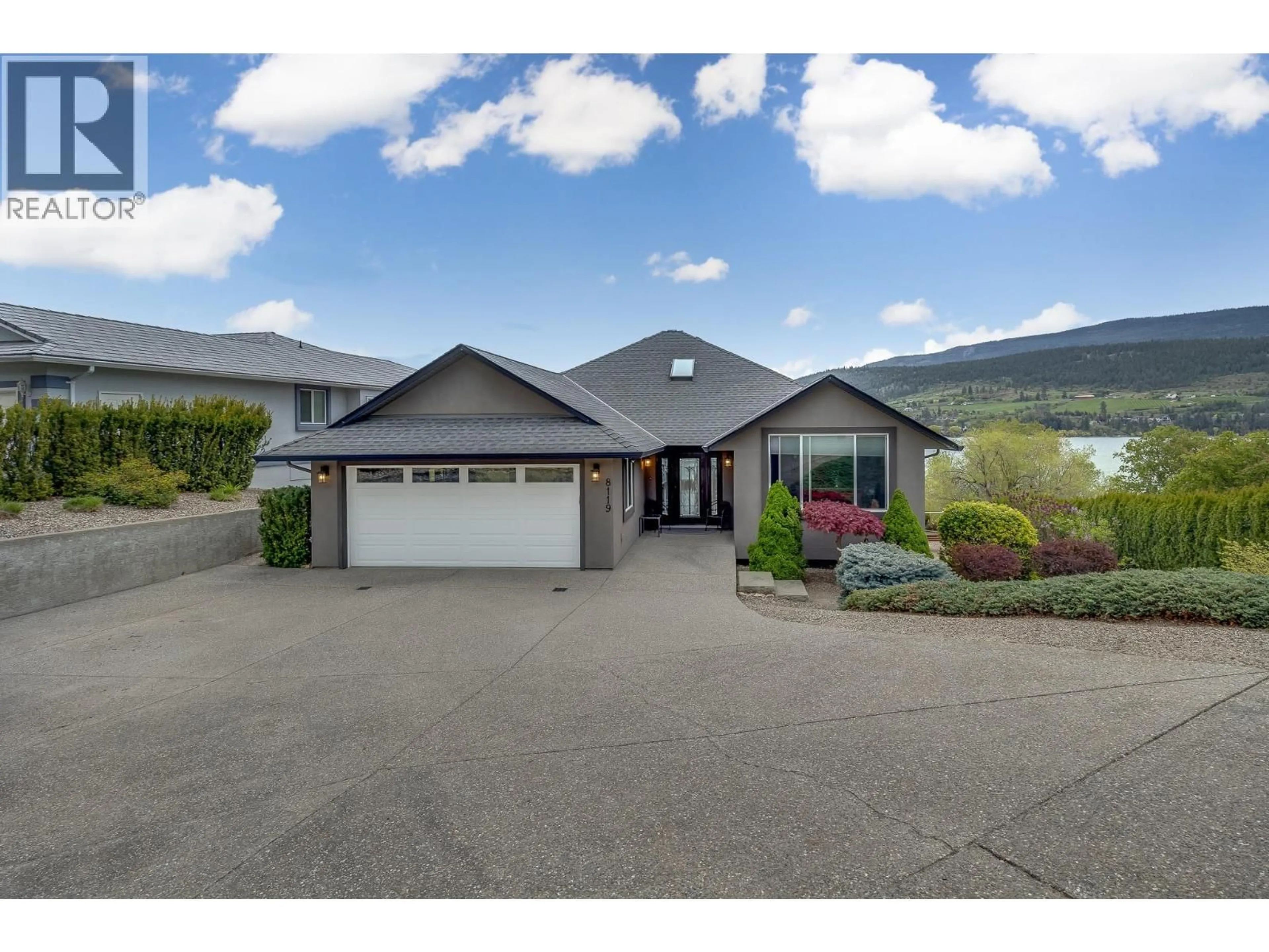 A pic from outside/outdoor area/front of a property/back of a property/a pic from drone, mountain view for 8119 STONERIDGE DRIVE, Coldstream British Columbia V1B2T8