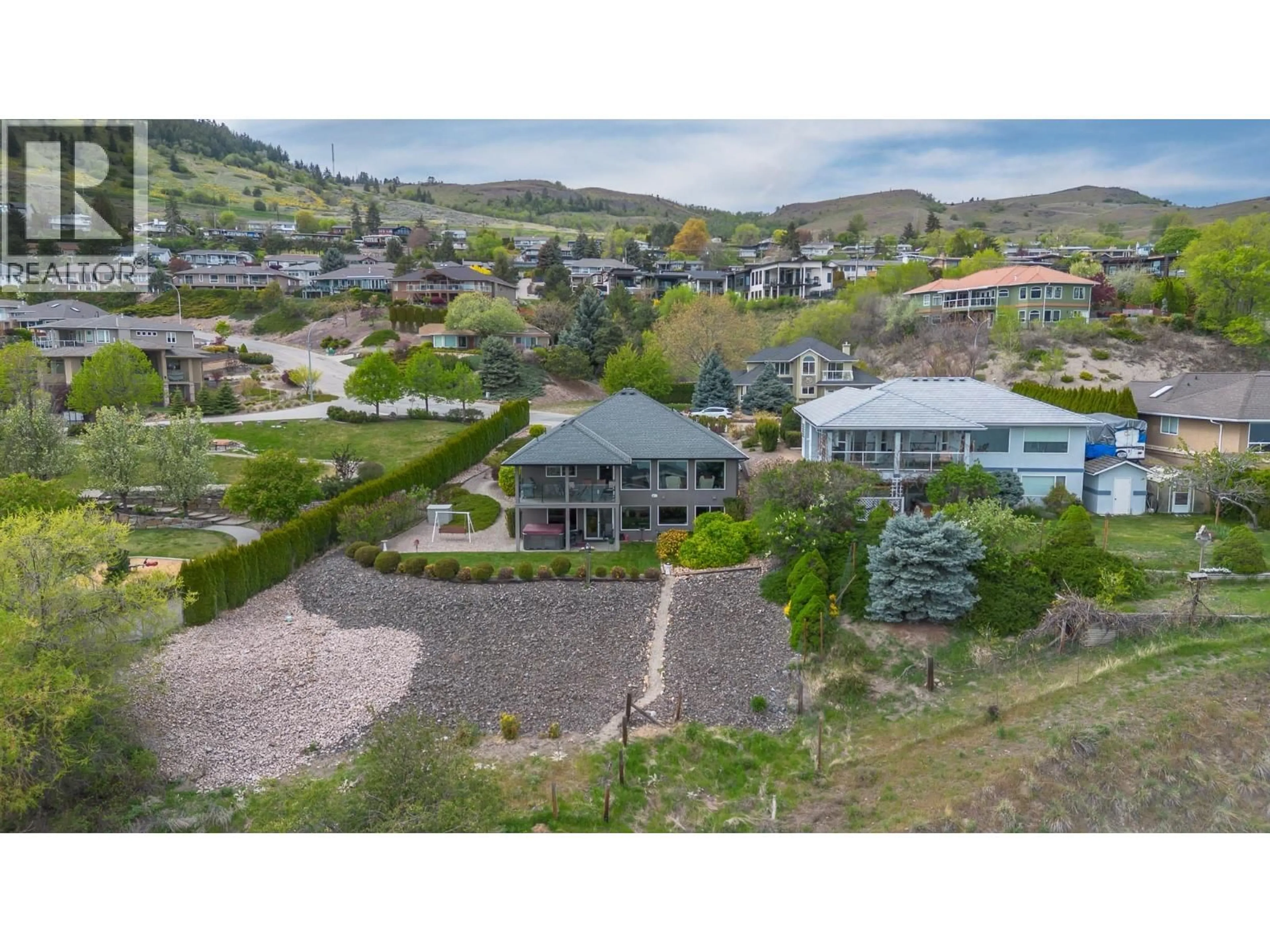 A pic from outside/outdoor area/front of a property/back of a property/a pic from drone, mountain view for 8119 STONERIDGE DRIVE, Coldstream British Columbia V1B2T8