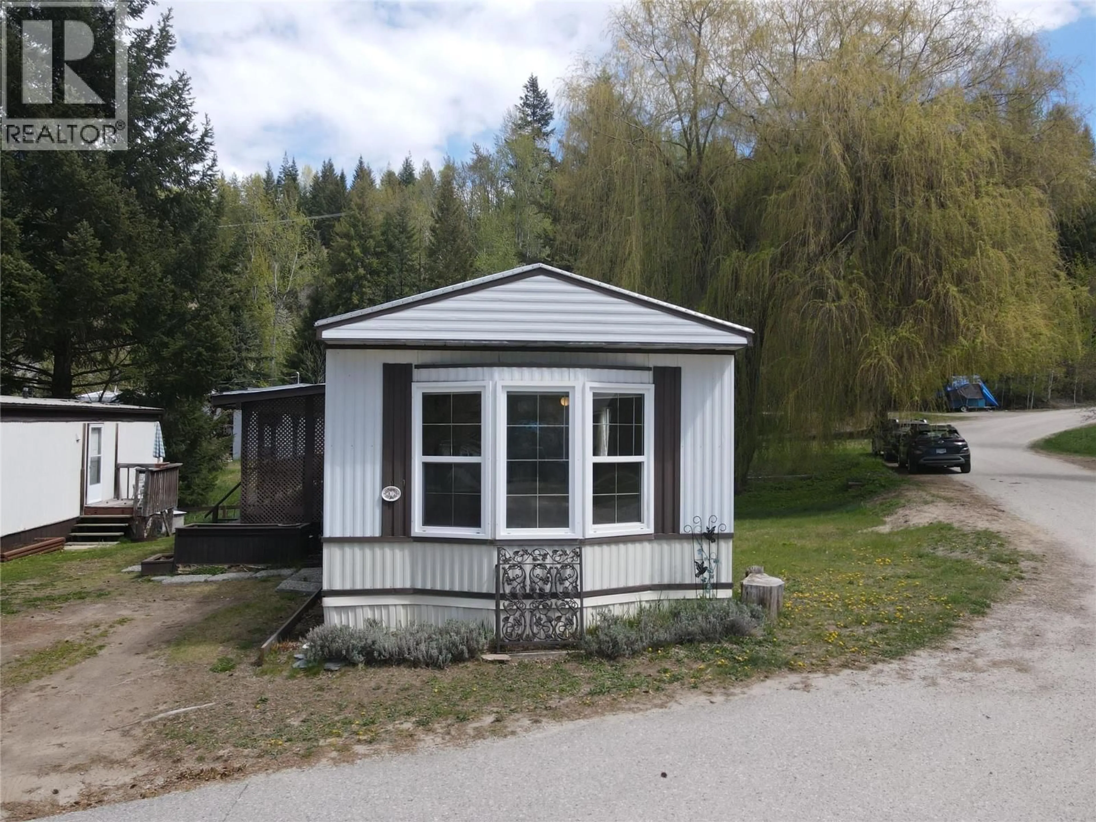 Home with vinyl exterior material, street for 13 - 2917 GEORAMA ROAD, Nelson British Columbia V1L6Y7