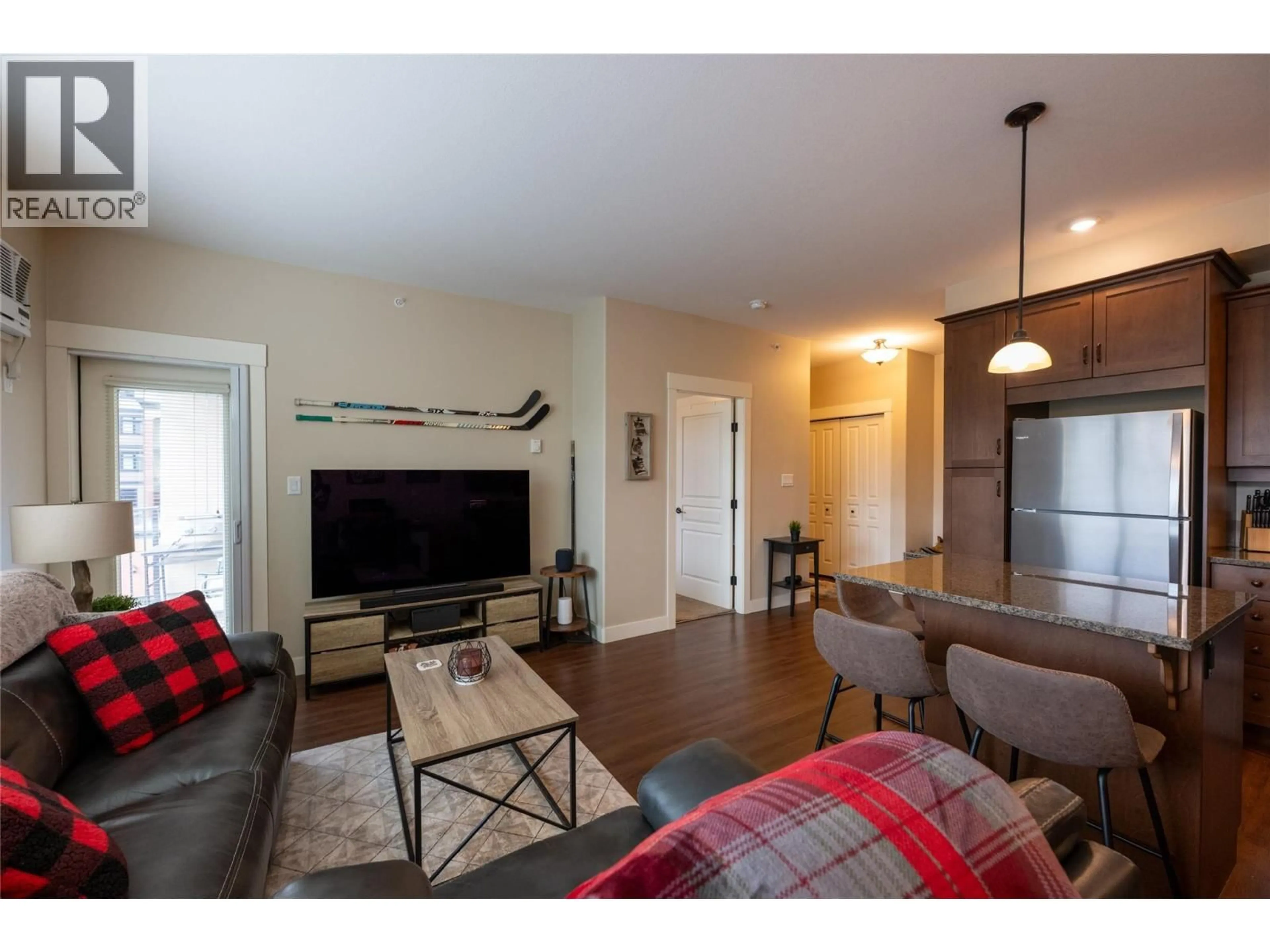 Living room with furniture, wood/laminate floor for 403 - 755 MCGILL ROAD, Kamloops British Columbia V2C0B6