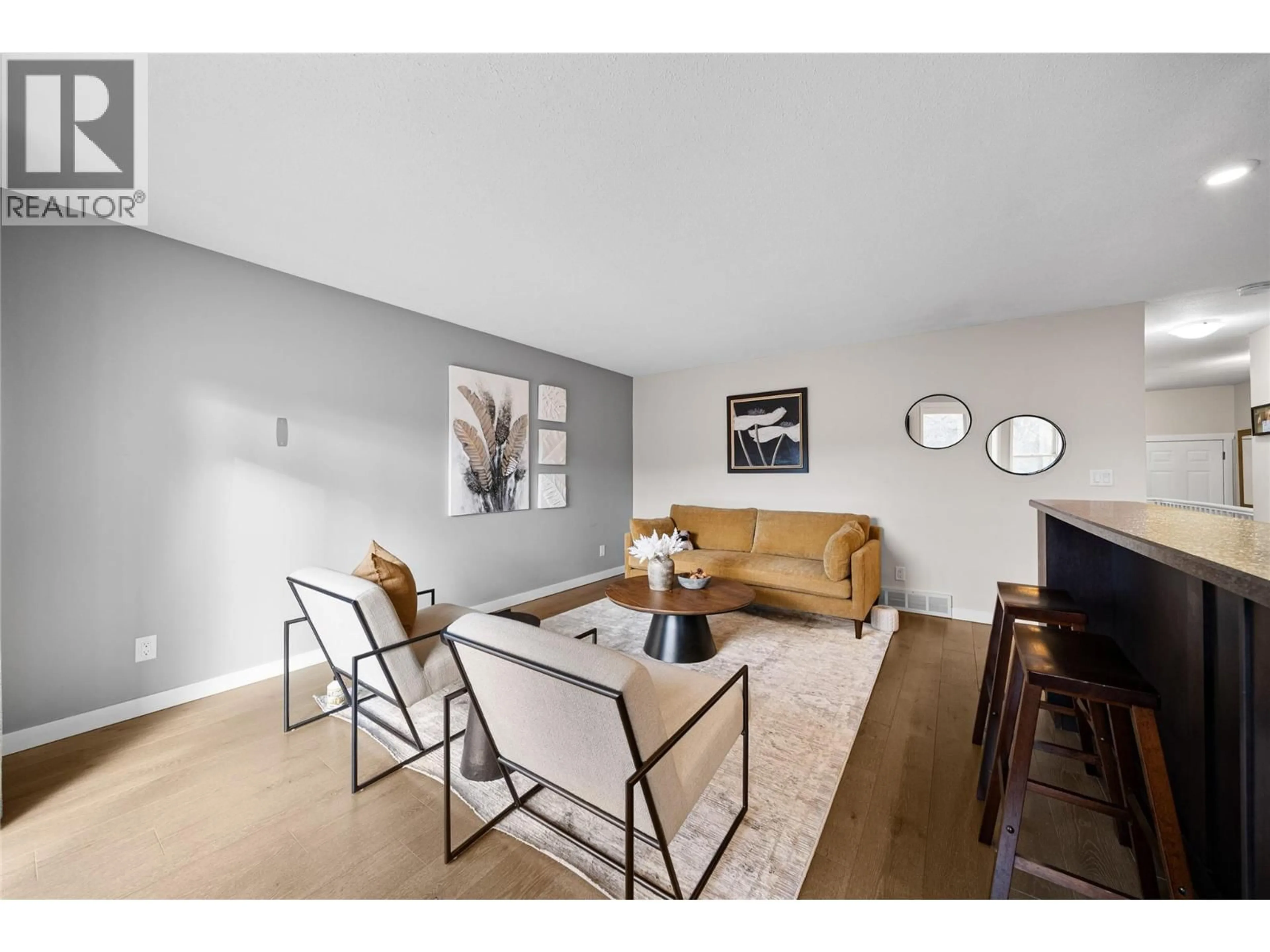 Living room with furniture, wood/laminate floor for 4 - 1750 MCKINLEY COURT, Kamloops British Columbia V2E2N5