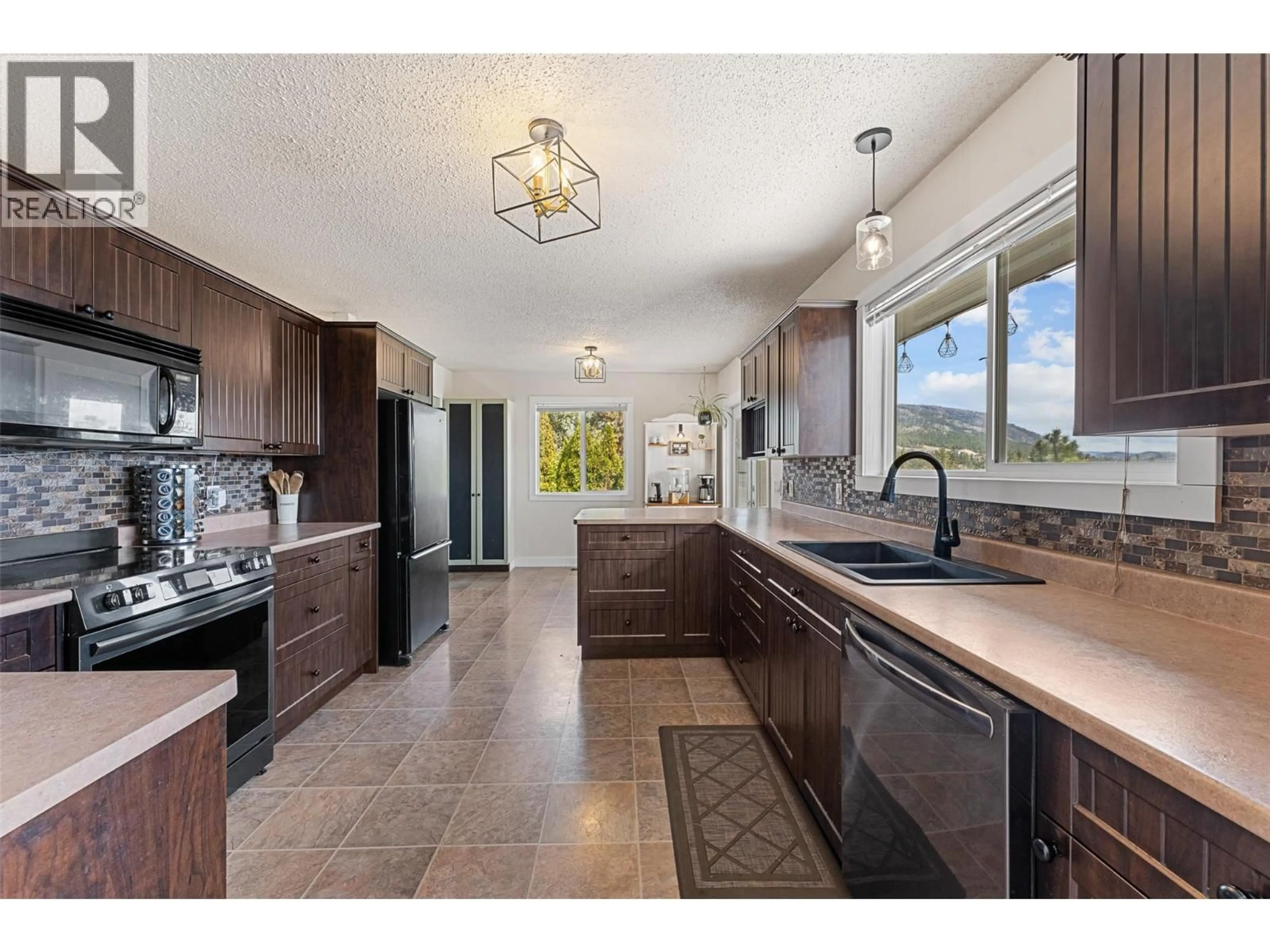 Open concept kitchen, ceramic/tile floor for 3349 MCQUEEN ROAD, West Kelowna British Columbia V4T1B7
