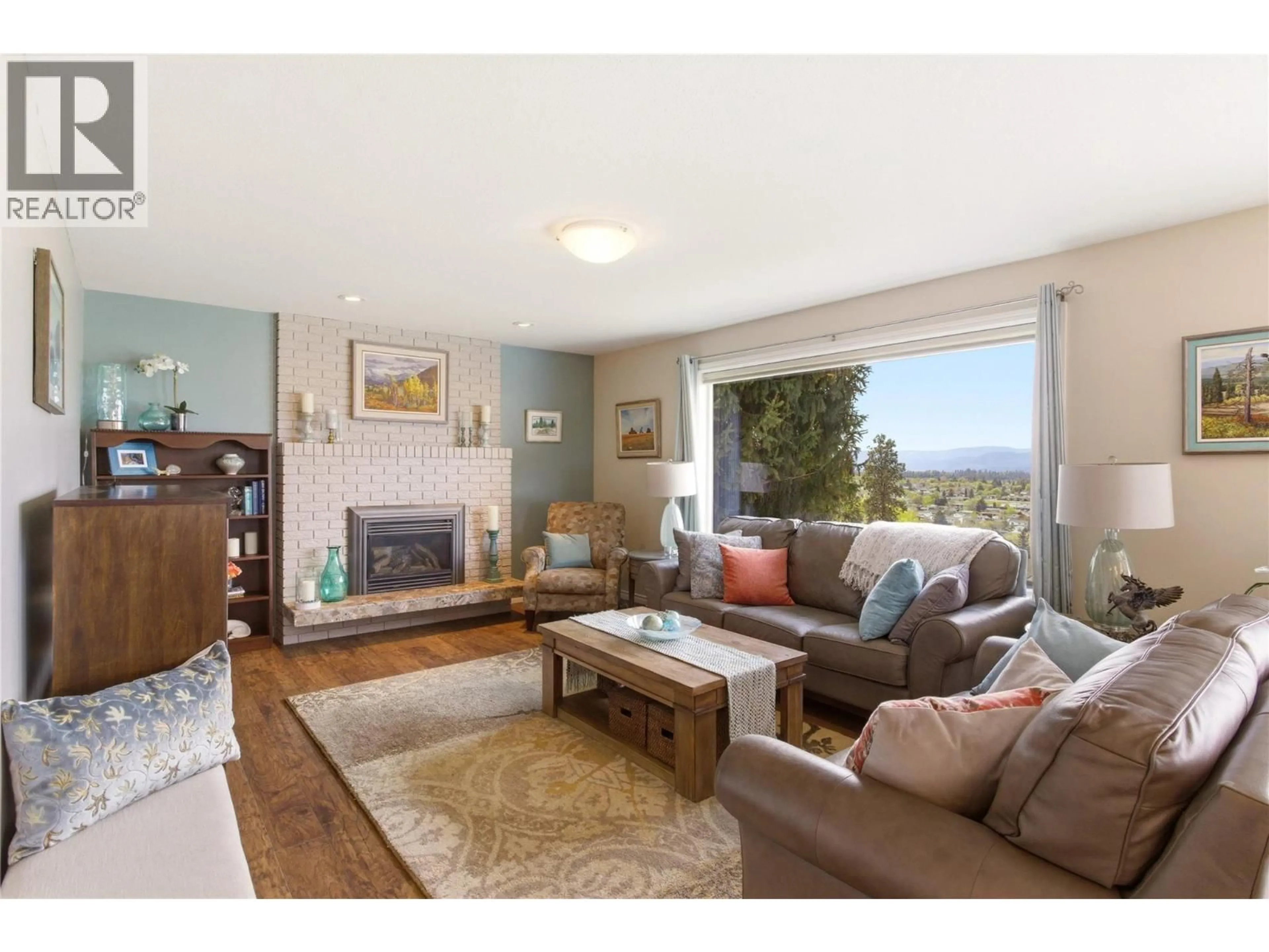 Living room with furniture, wood/laminate floor for 869 MCKENZIE ROAD, Kelowna British Columbia V1X2B4