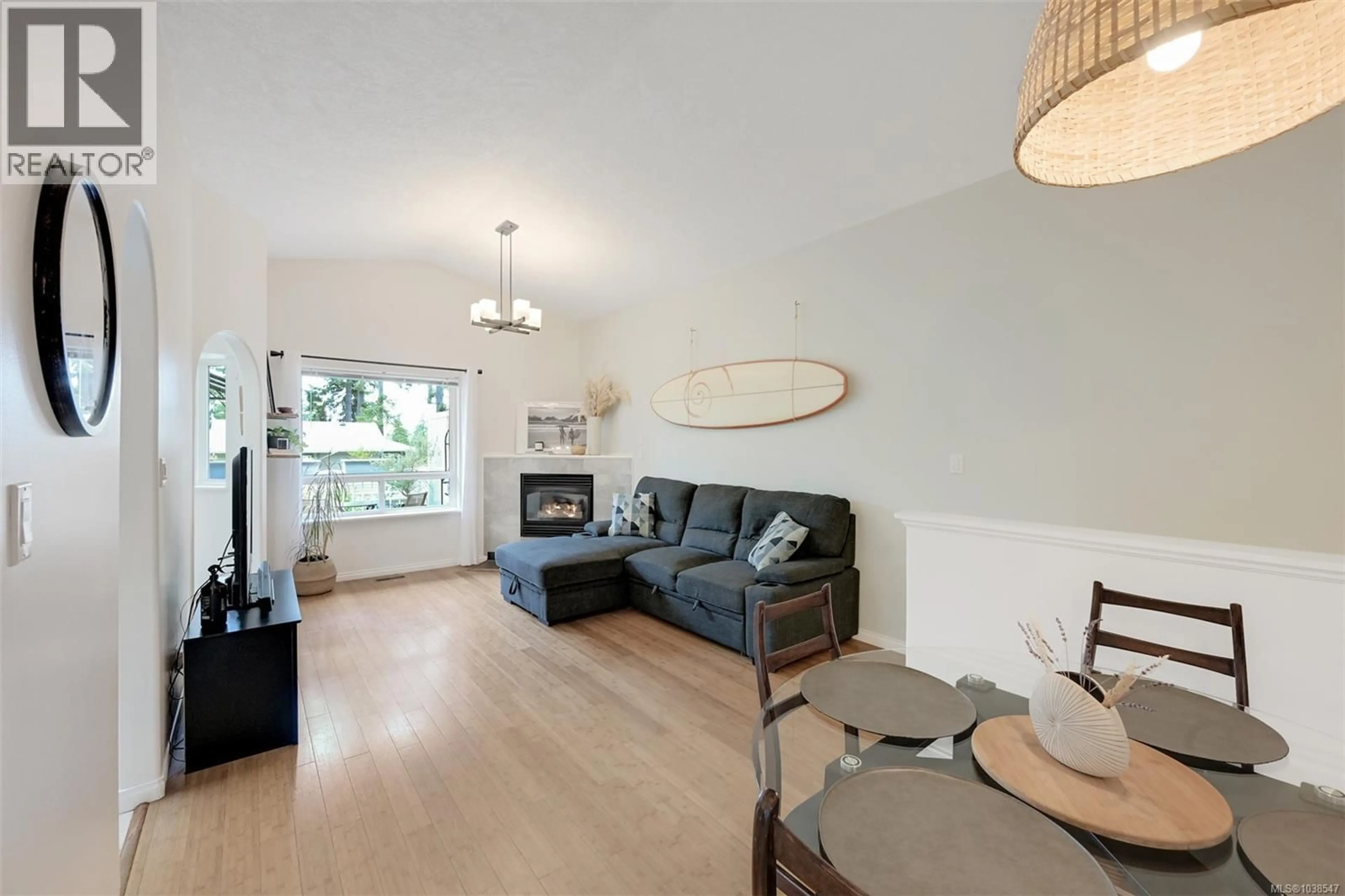Living room with furniture, wood/laminate floor for 5909 UPLAND AVENUE, Duncan British Columbia V9L6P7