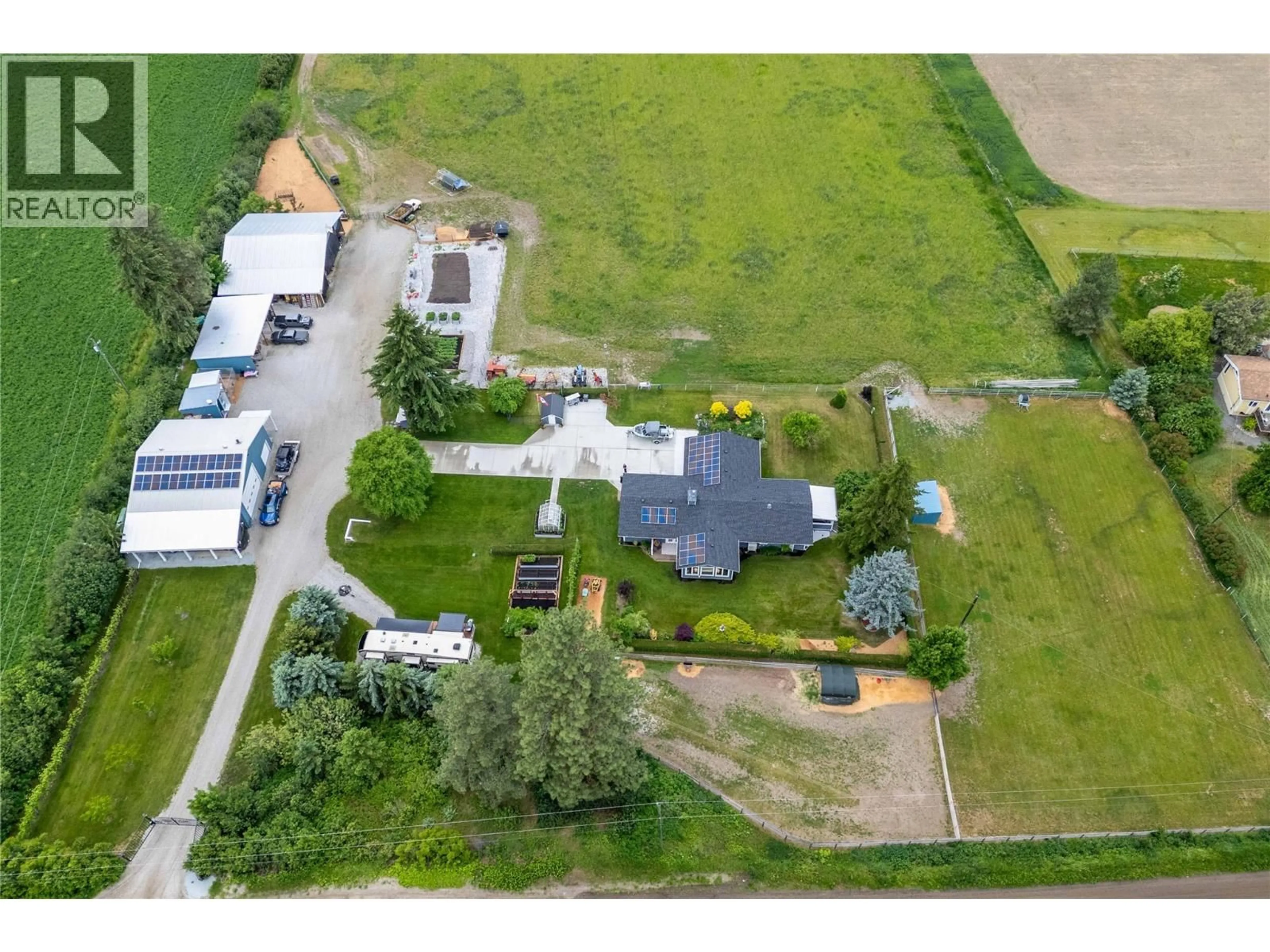A pic from outside/outdoor area/front of a property/back of a property/a pic from drone, street for 4911 MALPASS ROAD, Armstrong British Columbia V4Y0V5