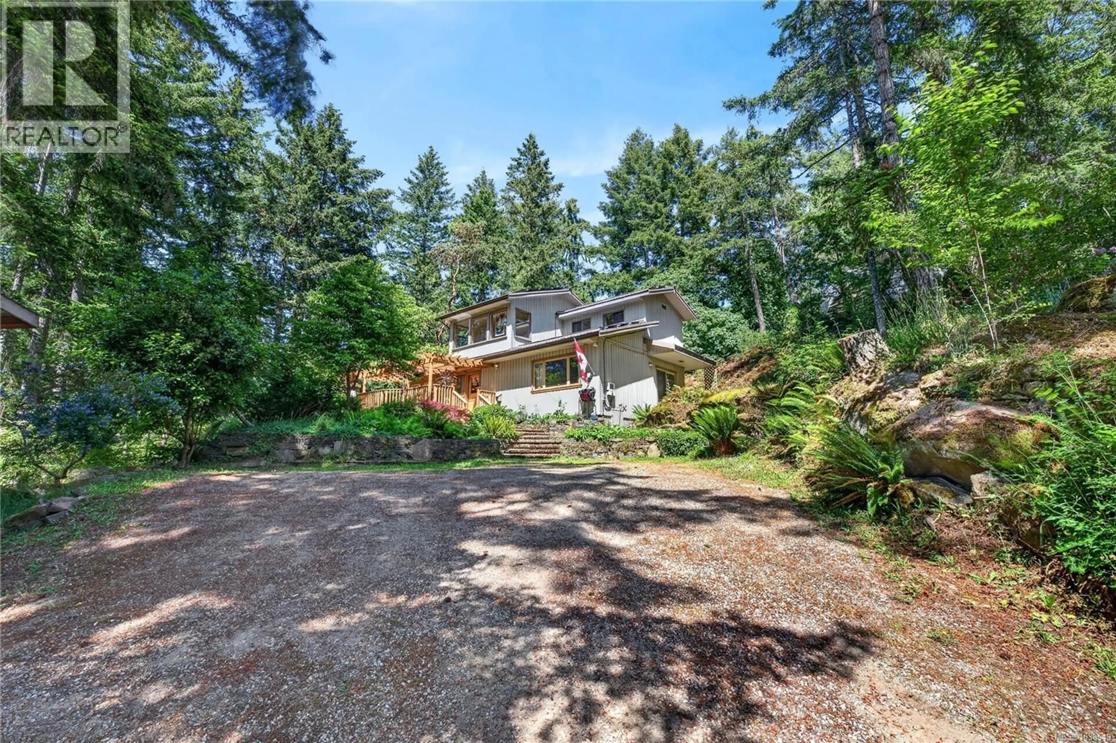 A pic from outside/outdoor area/front of a property/back of a property/a pic from drone, forest/trees view for 654 VESUVIUS BAY ROAD, Salt Spring British Columbia V8K2T2