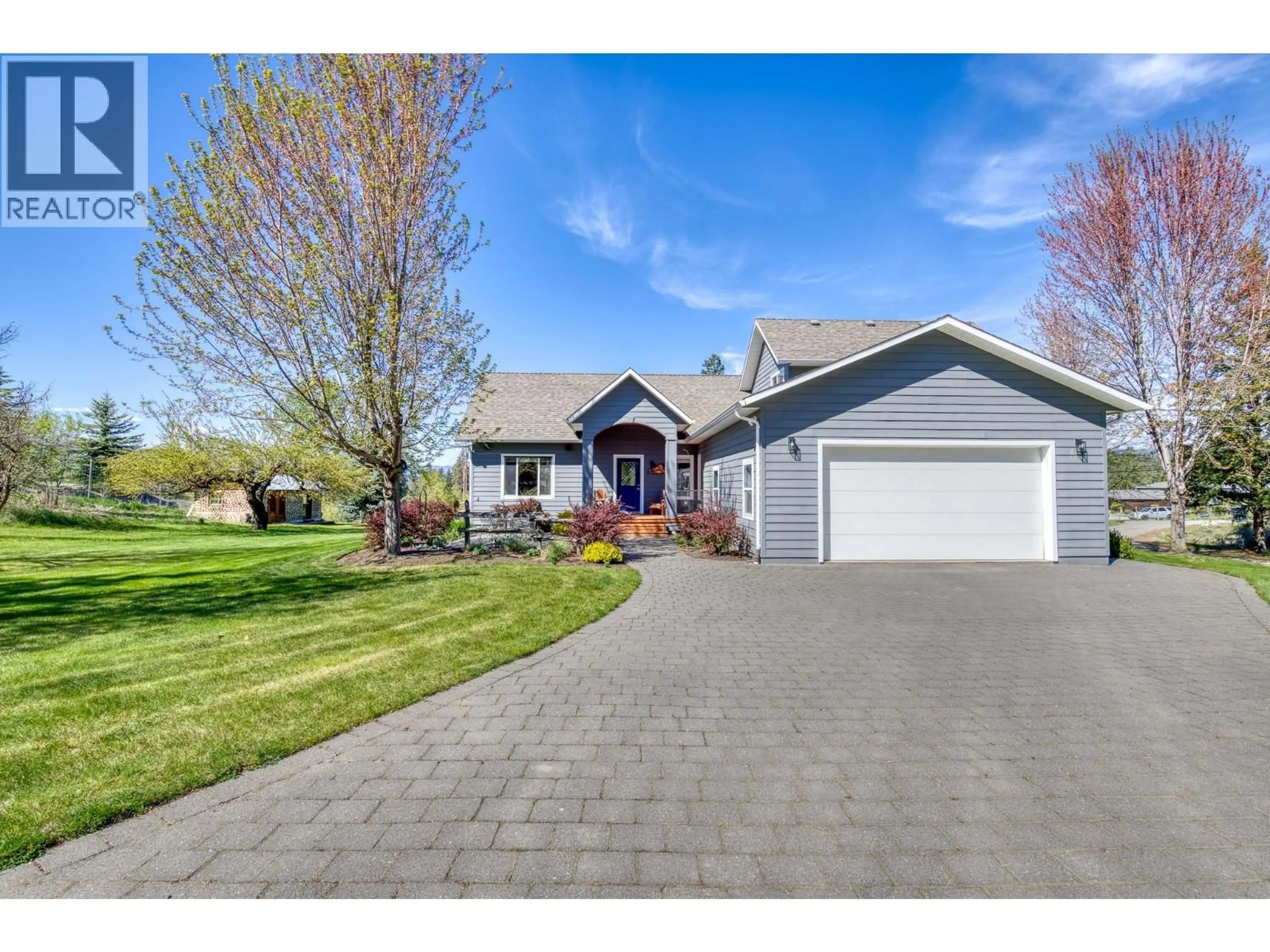 Home with vinyl exterior material, street for 3990 JUNE SPRINGS ROAD, Kelowna British Columbia V1W4E4