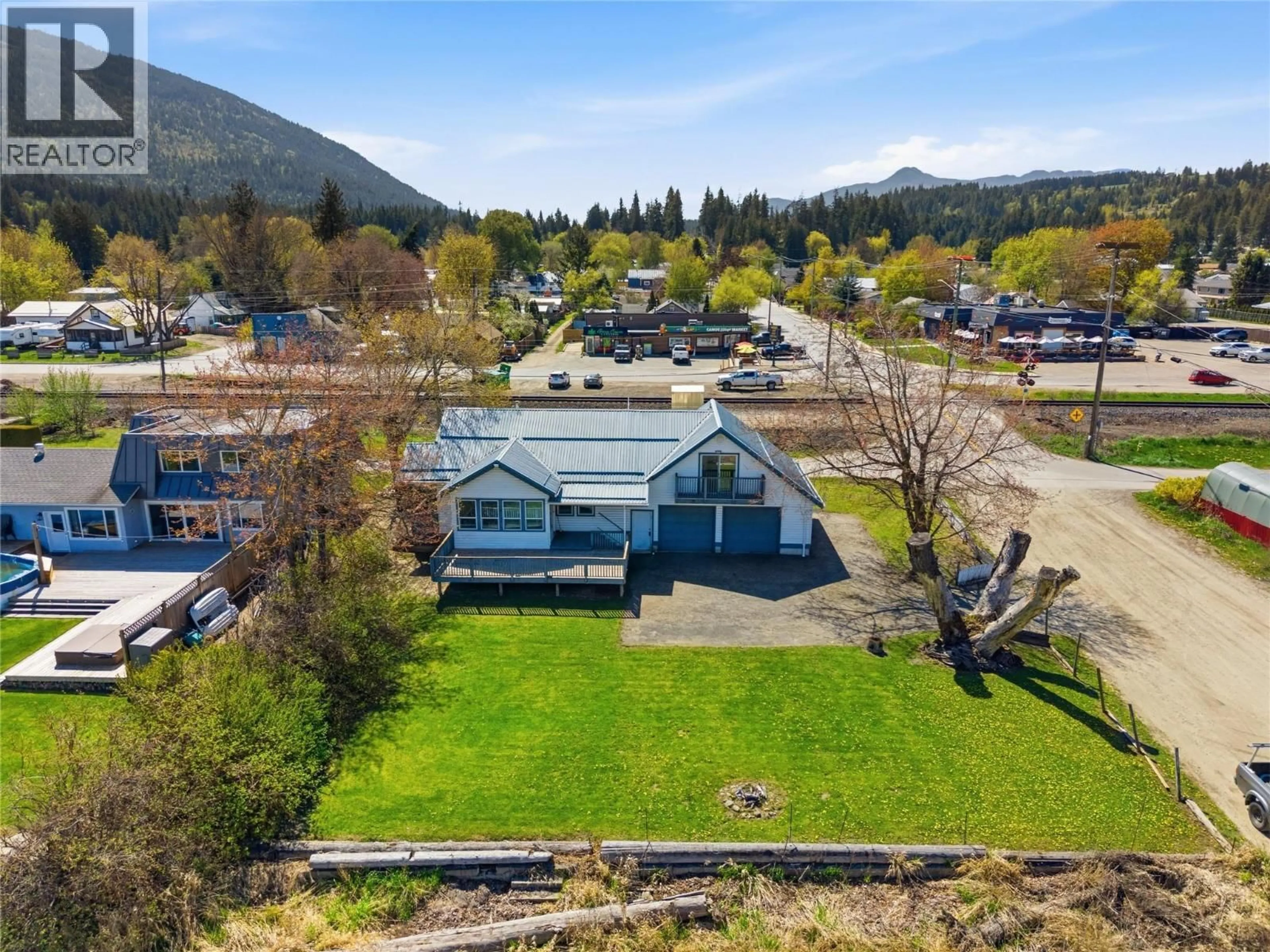 A pic from outside/outdoor area/front of a property/back of a property/a pic from drone, mountain view for 5041 75 AVENUE NORTHEAST, Salmon Arm British Columbia V0E1K0