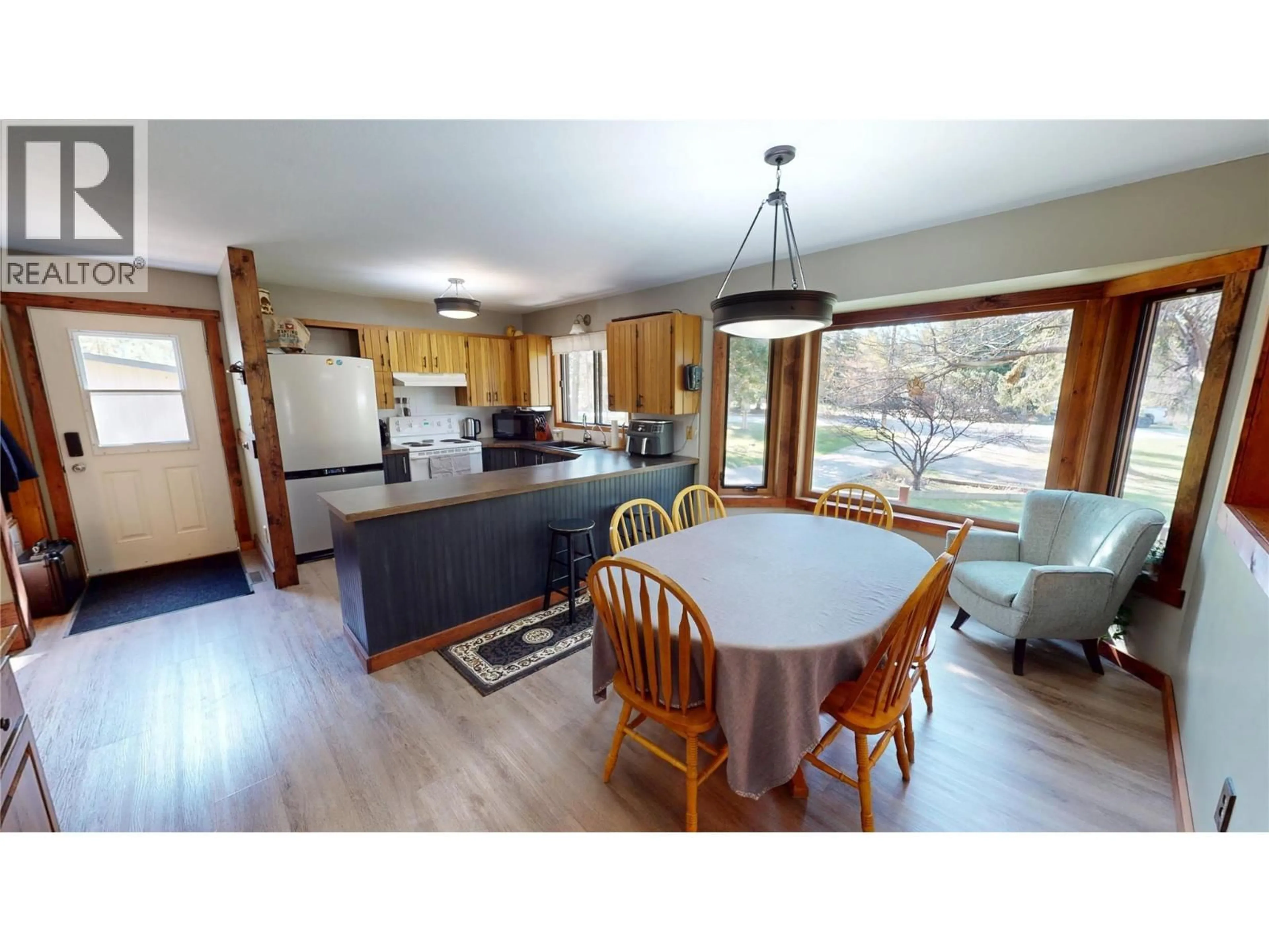 Open concept kitchen, wood/laminate floor for 4775 NELLES CRESCENT, Windermere British Columbia V0B2L0