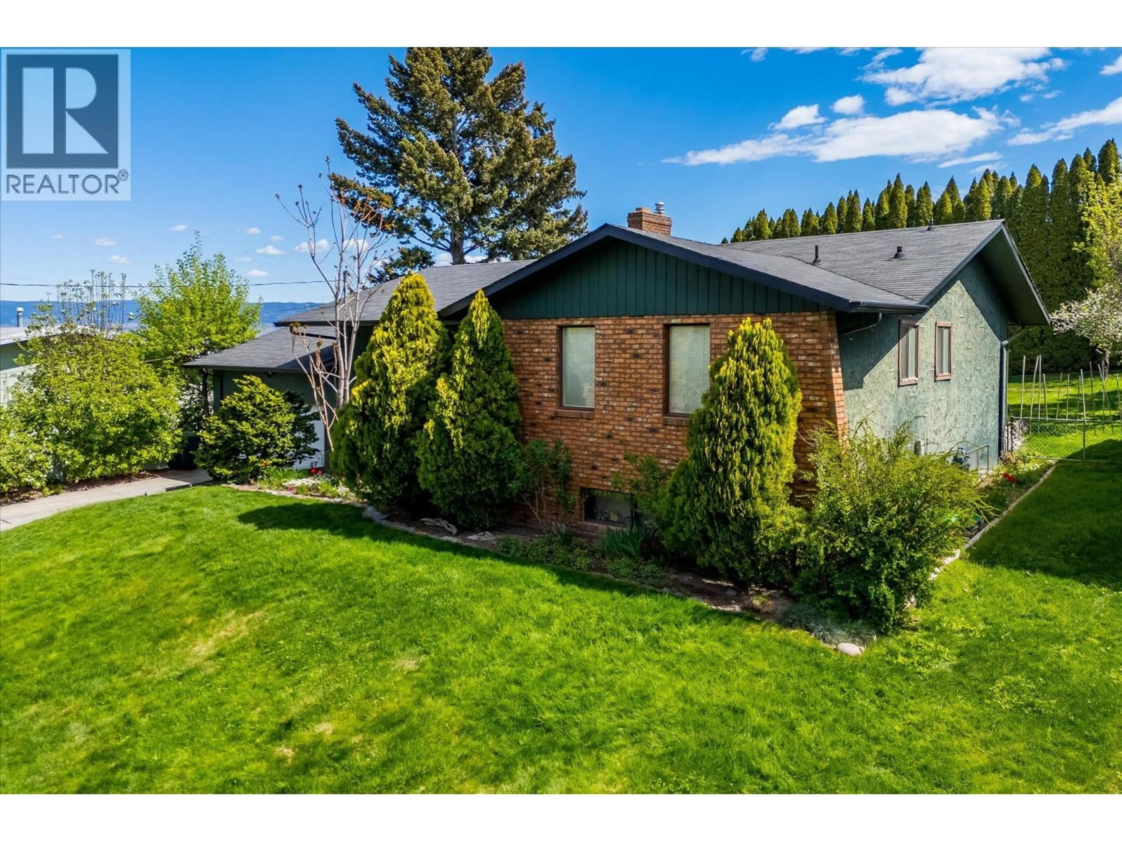 A pic from outside/outdoor area/front of a property/back of a property/a pic from drone, street for 2425 COLLINGWOOD ROAD, West Kelowna British Columbia V1Z3C3