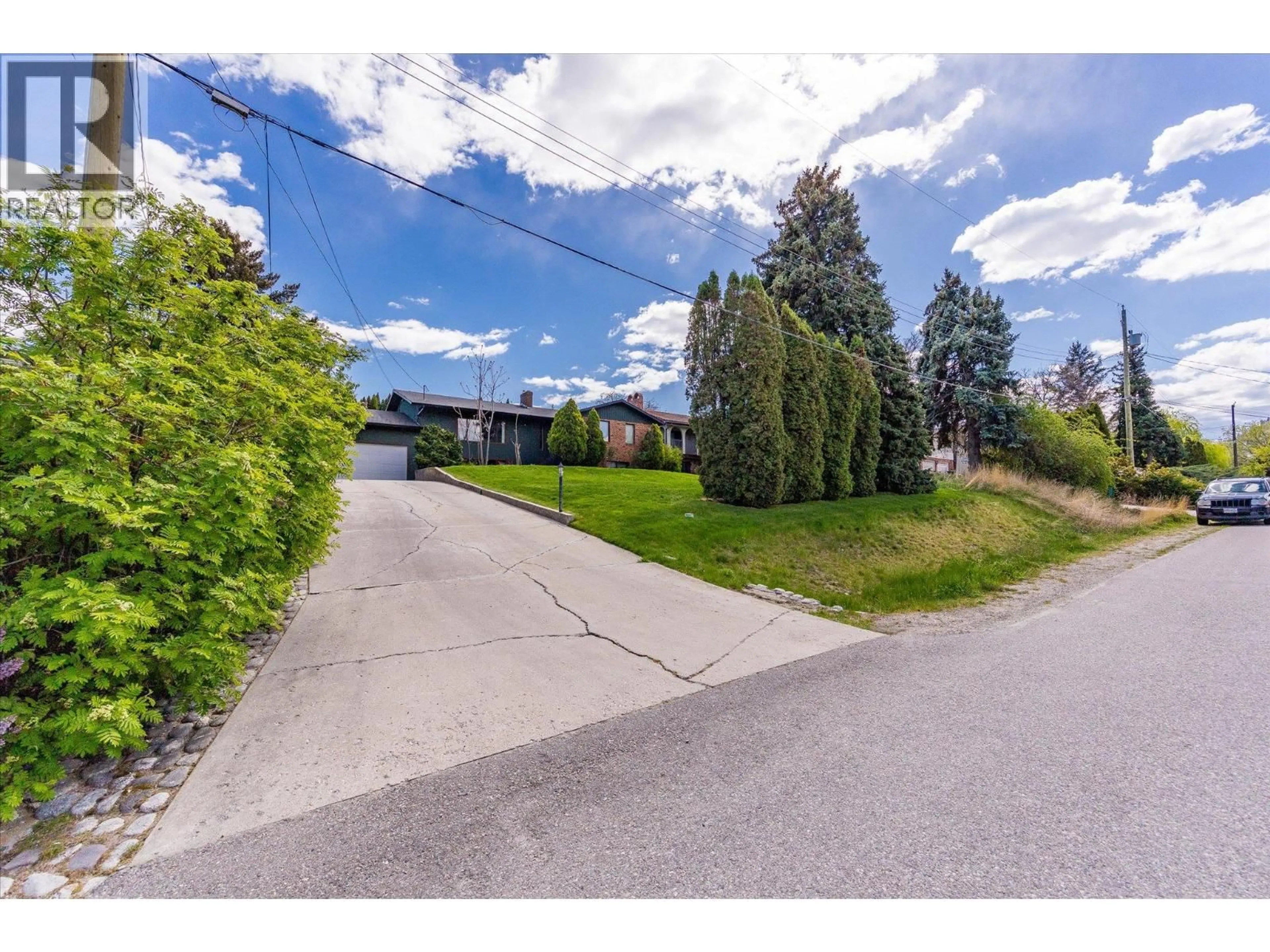 A pic from outside/outdoor area/front of a property/back of a property/a pic from drone, street for 2425 COLLINGWOOD ROAD, West Kelowna British Columbia V1Z3C3