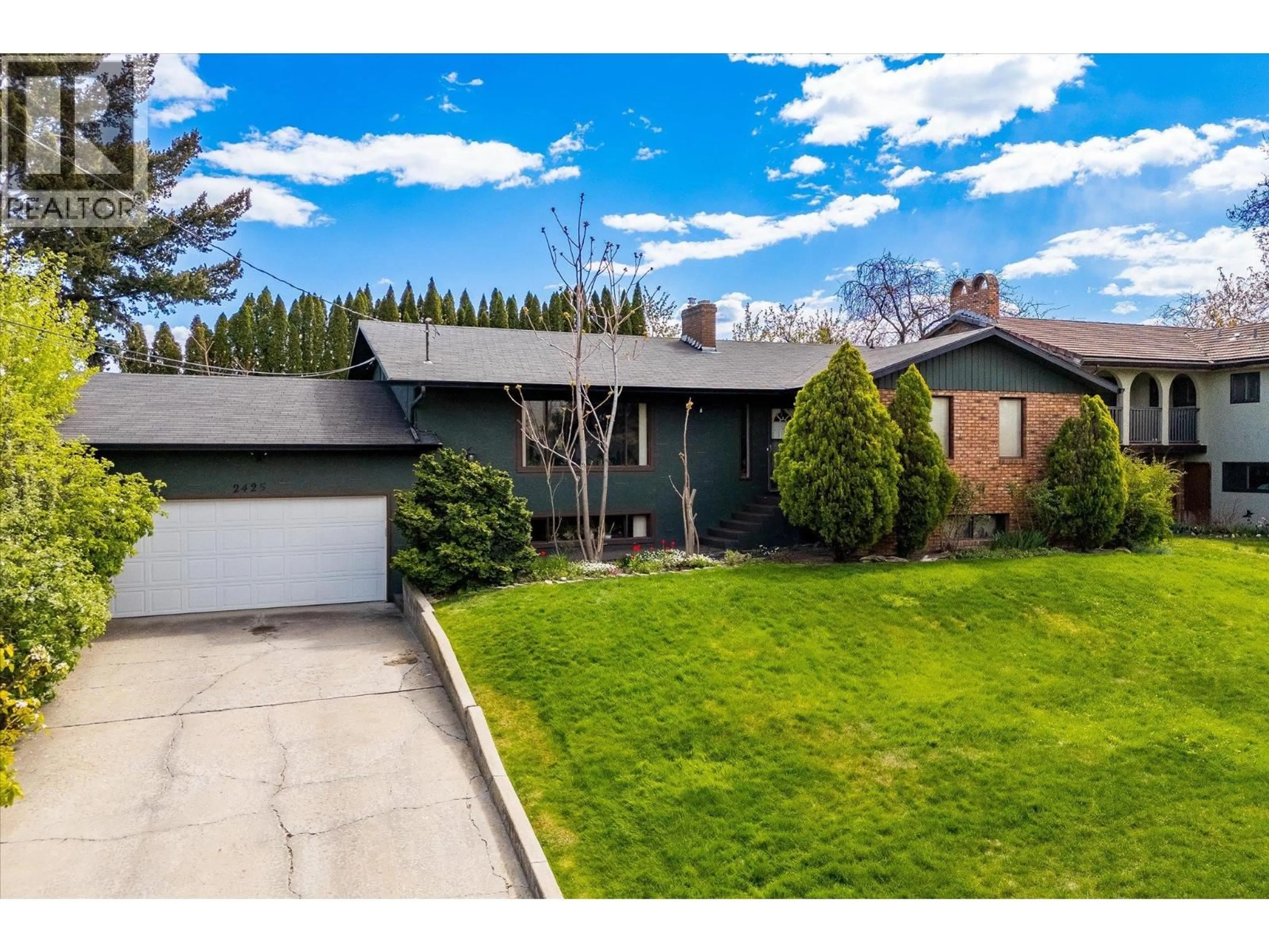 Home with vinyl exterior material, street for 2425 COLLINGWOOD ROAD, West Kelowna British Columbia V1Z3C3