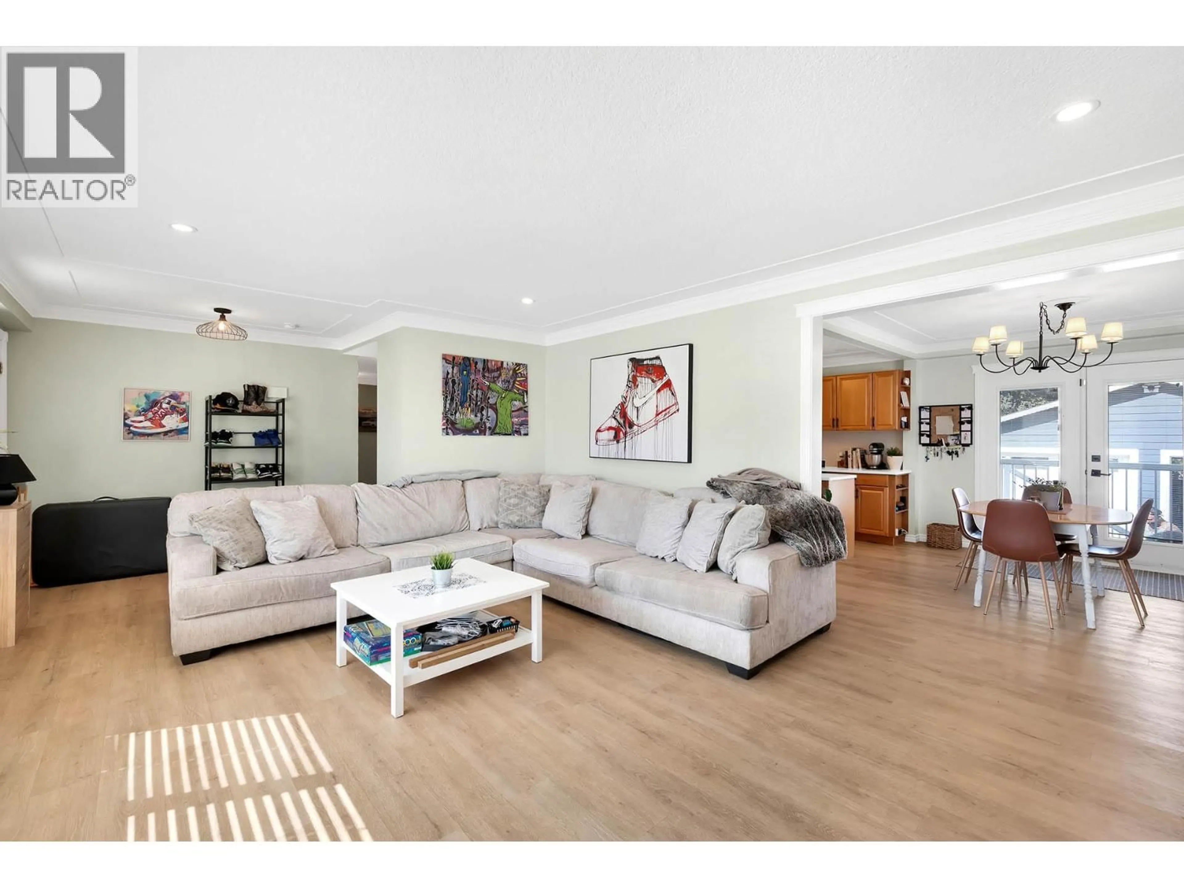Living room with furniture, wood/laminate floor for 2436 YOUNG AVENUE, Kamloops British Columbia V2B4M8