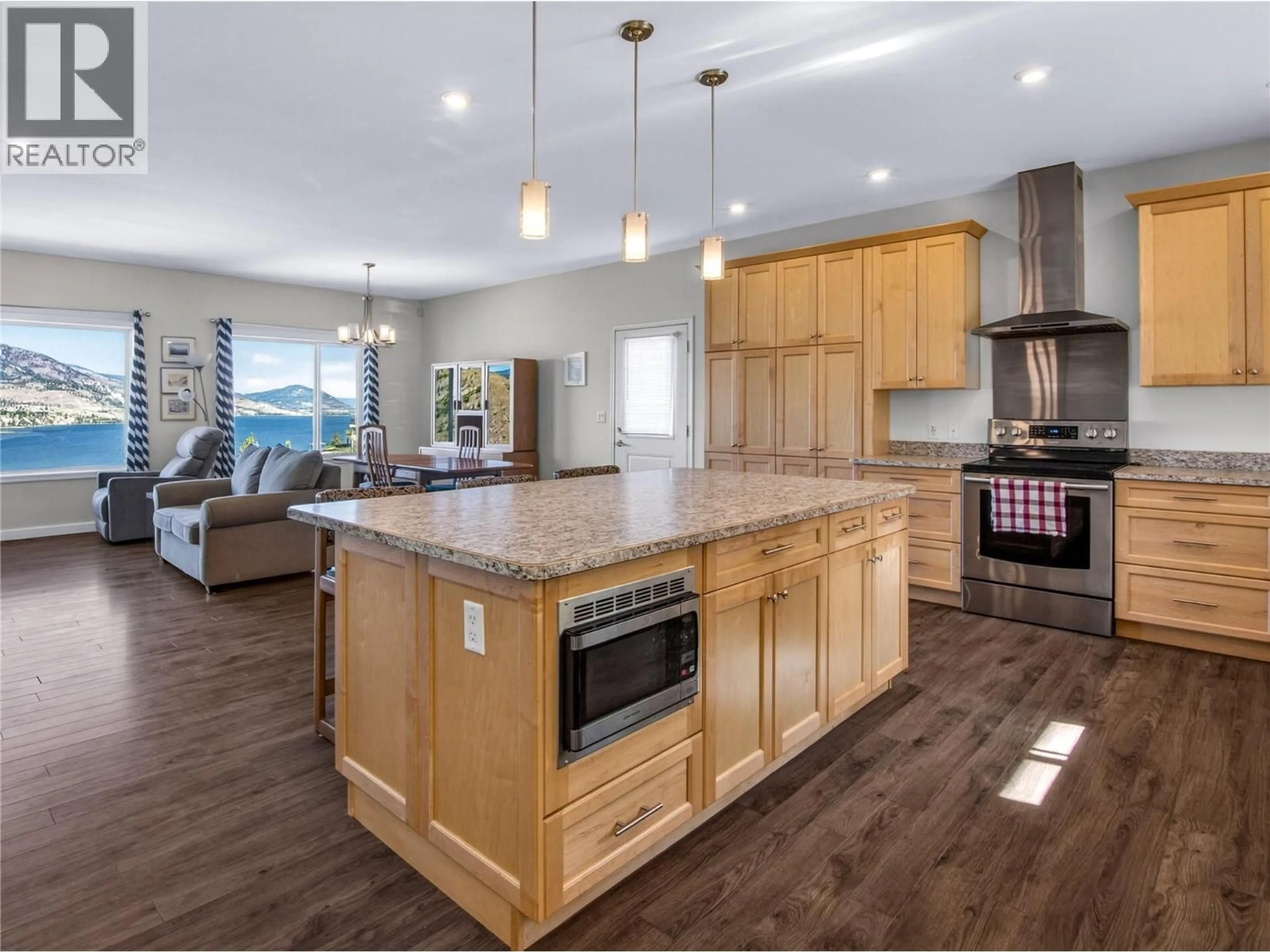 Open concept kitchen, wood/laminate floor for 182 RACETTE WAY, Okanagan Falls British Columbia V0H1R5