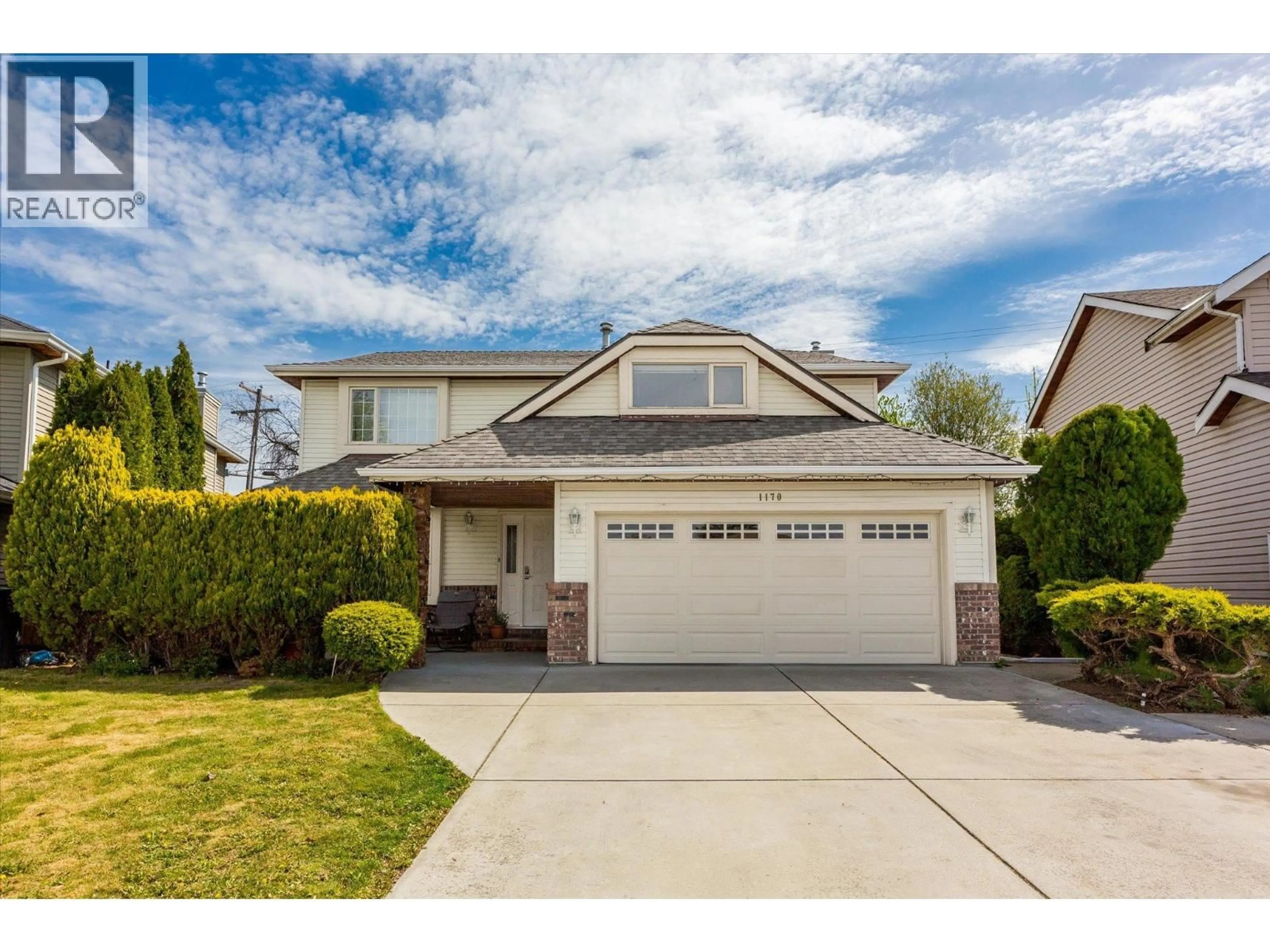 Home with vinyl exterior material, street for 1170 WINTERGREEN CRESCENT, Kelowna British Columbia V1W3V8