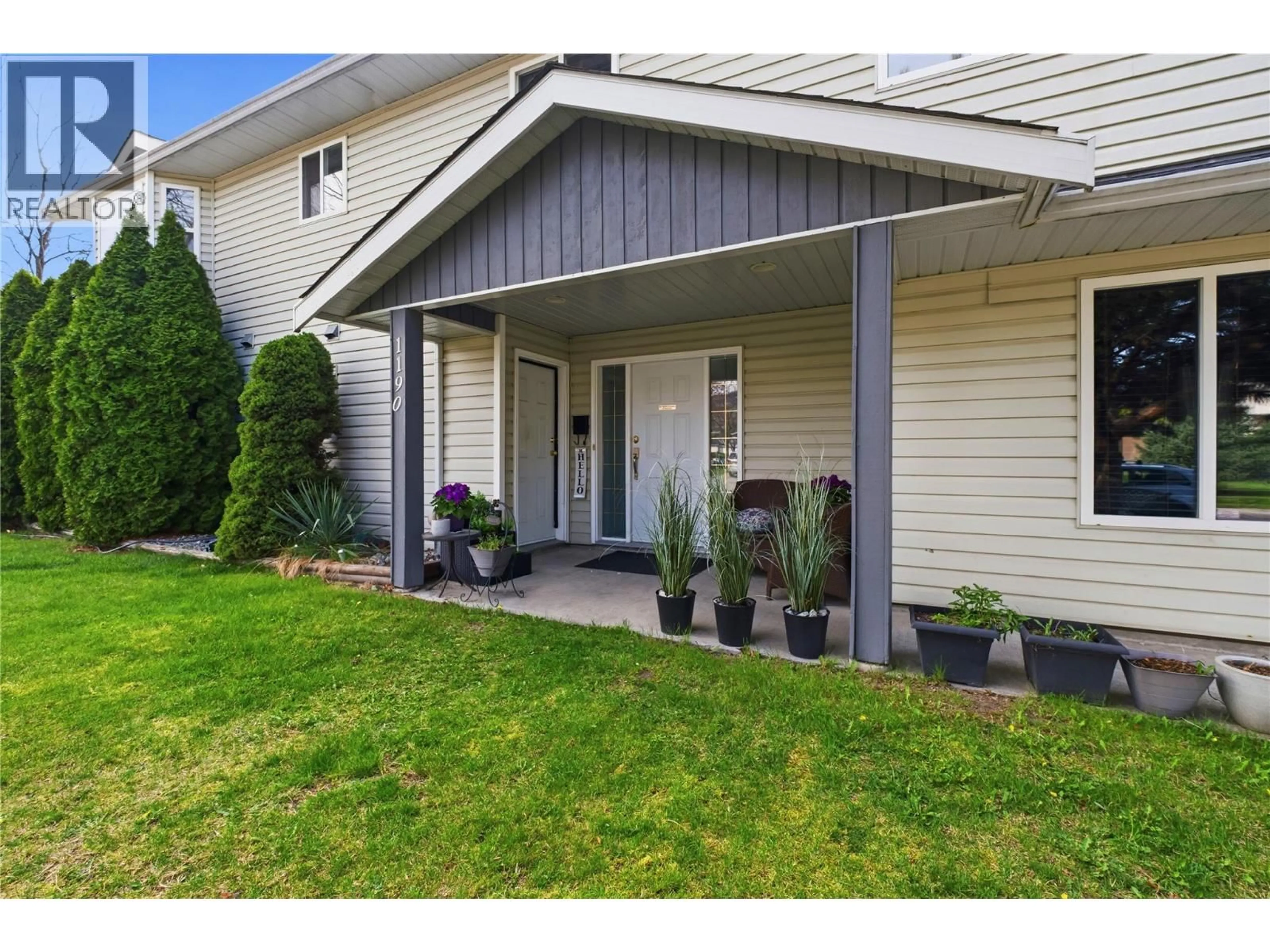 Home with vinyl exterior material, street for 1190 FRIESEN ROAD, Kelowna British Columbia V1X7N2