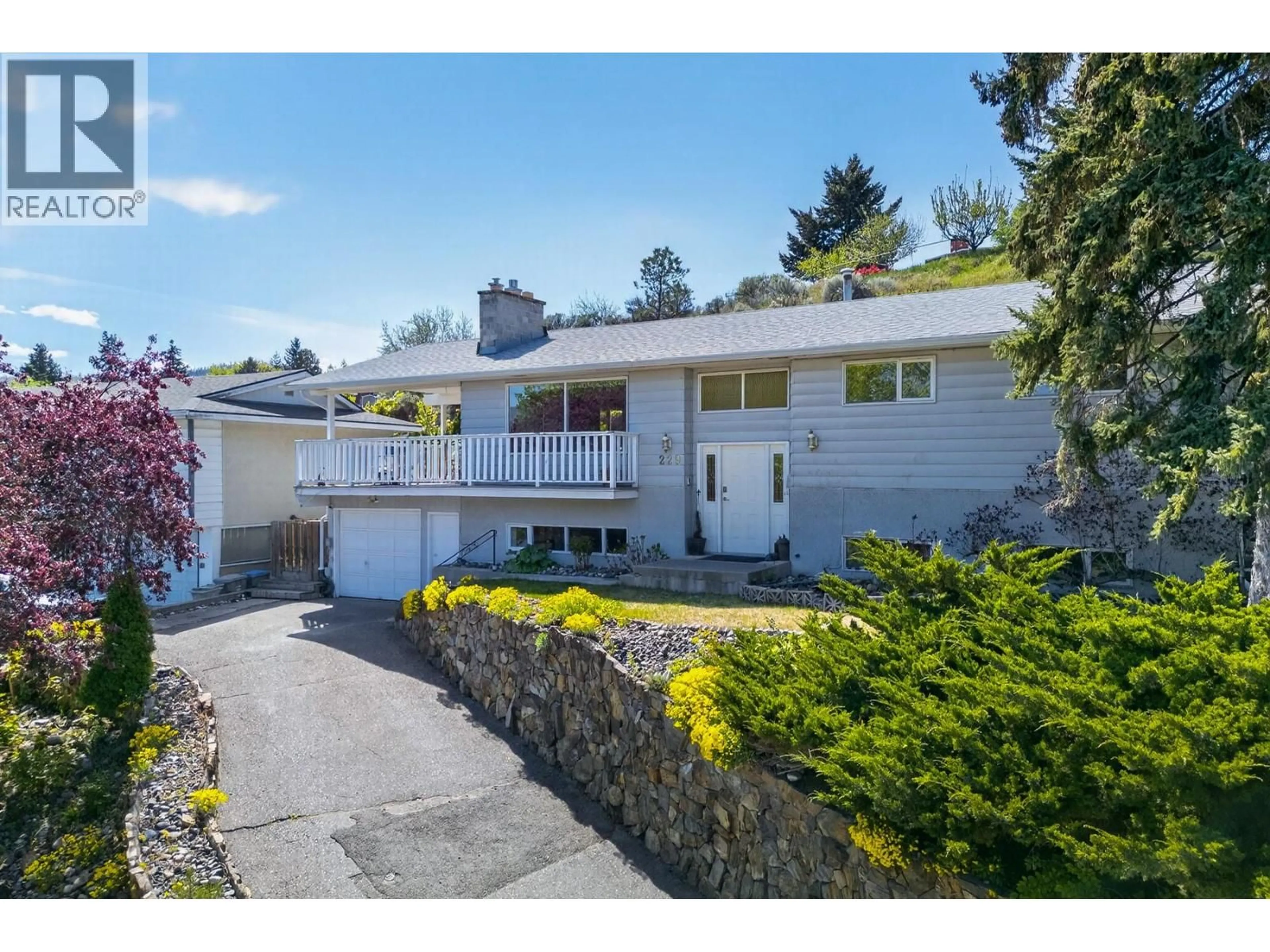 Home with vinyl exterior material, street for 229 GREENSTONE DRIVE, Kamloops British Columbia V2C1N6