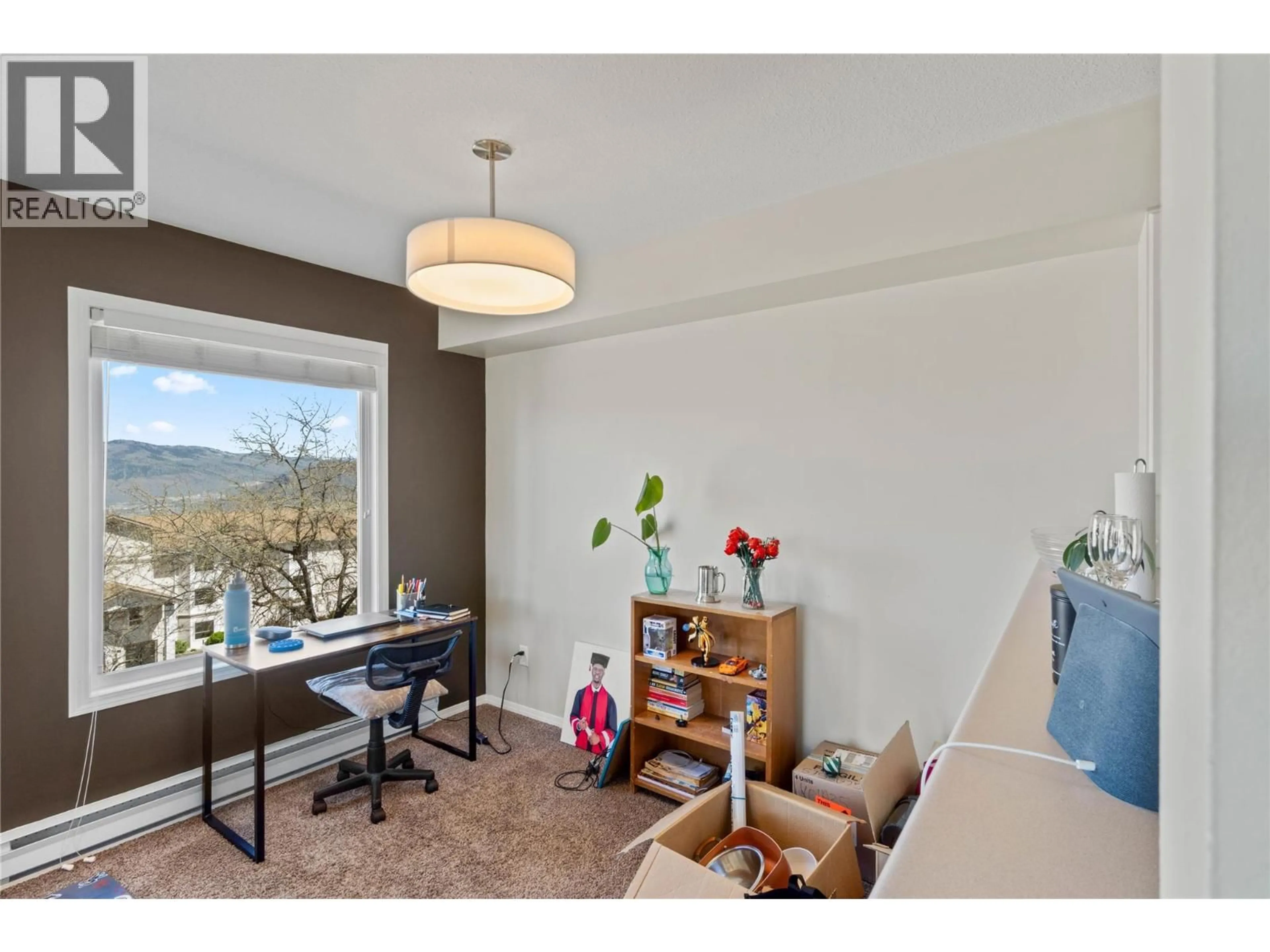 Living room with furniture, wood/laminate floor for 217 - 1170 HUGH ALLAN DRIVE, Kamloops British Columbia V1S1T5