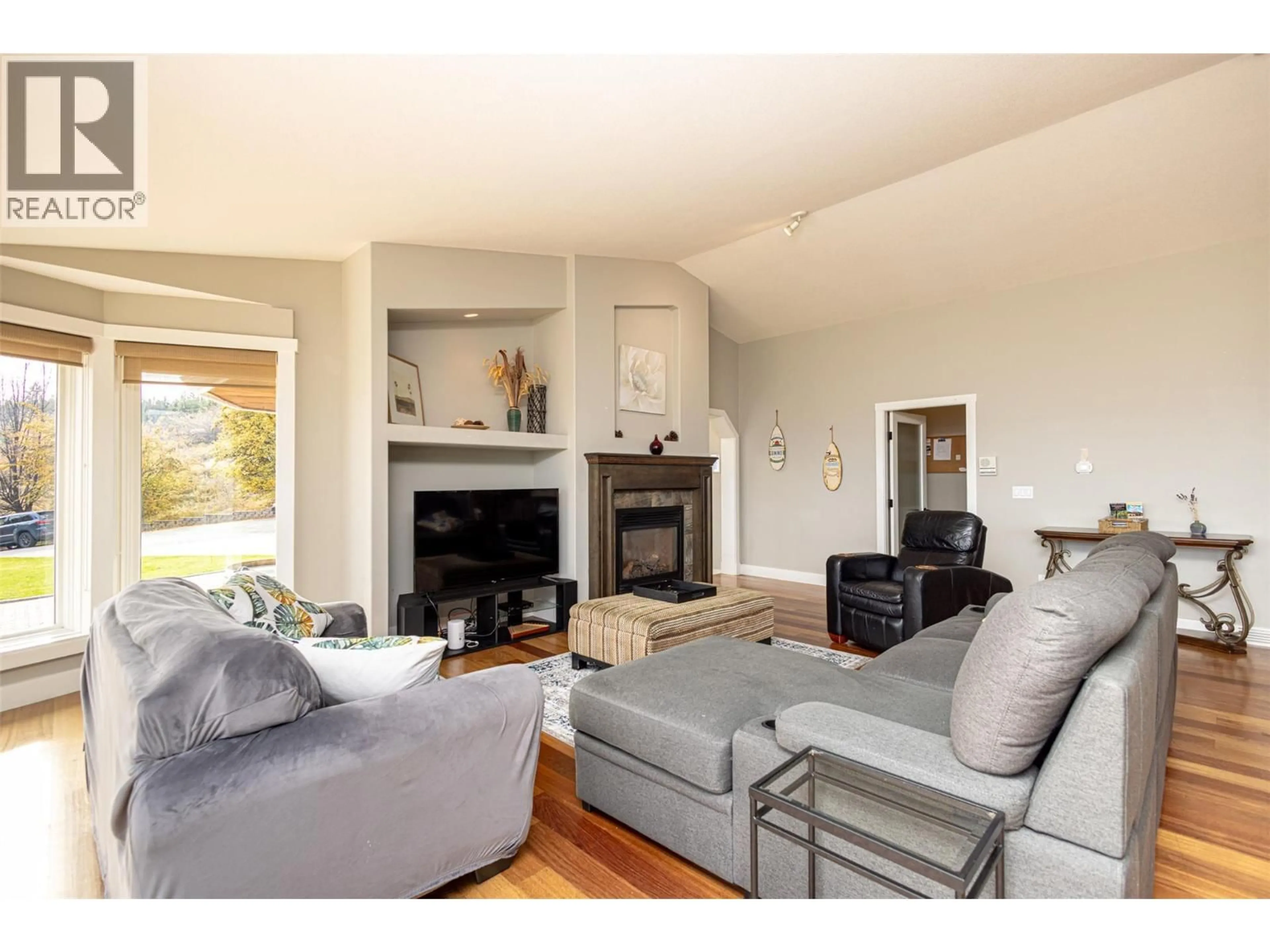 Living room with furniture, wood/laminate floor for 3510 GATES ROAD, West Kelowna British Columbia V4T1A2