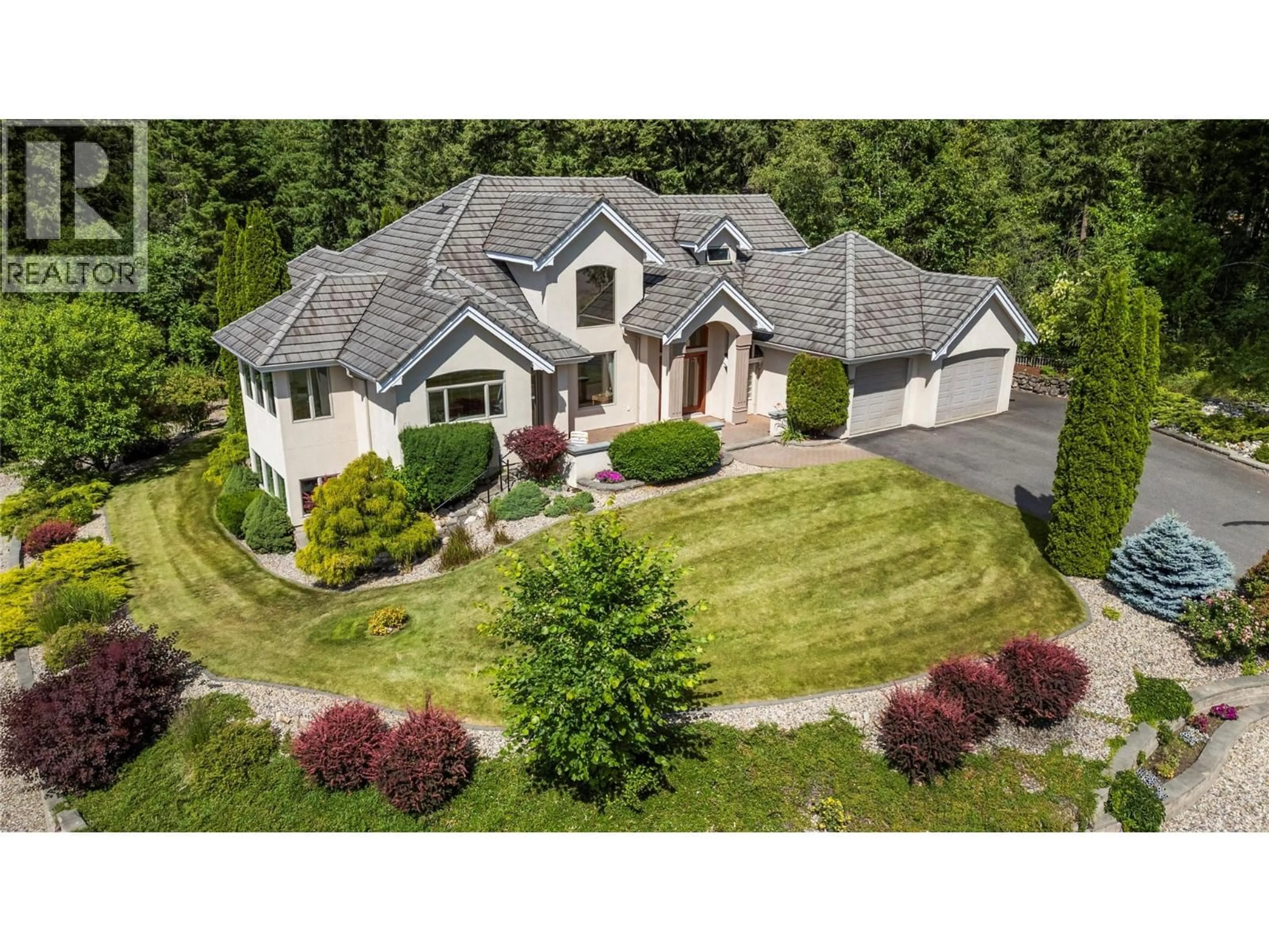 A pic from outside/outdoor area/front of a property/back of a property/a pic from drone, street for 1821 50 AVENUE NORTHEAST, Salmon Arm British Columbia V1E4P4