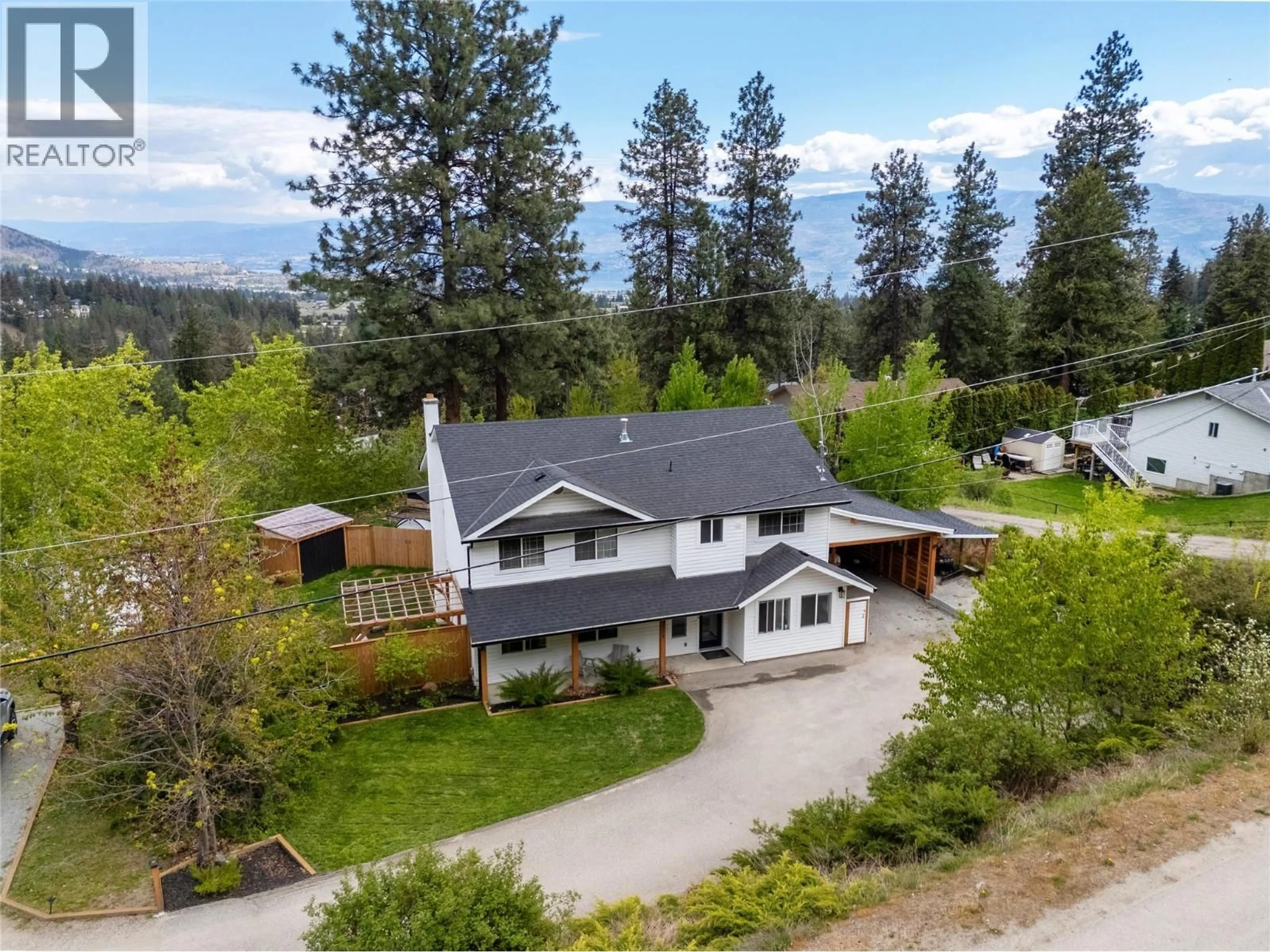 A pic from outside/outdoor area/front of a property/back of a property/a pic from drone, mountain view for 3171 CANARY DRIVE, West Kelowna British Columbia V4T1A4