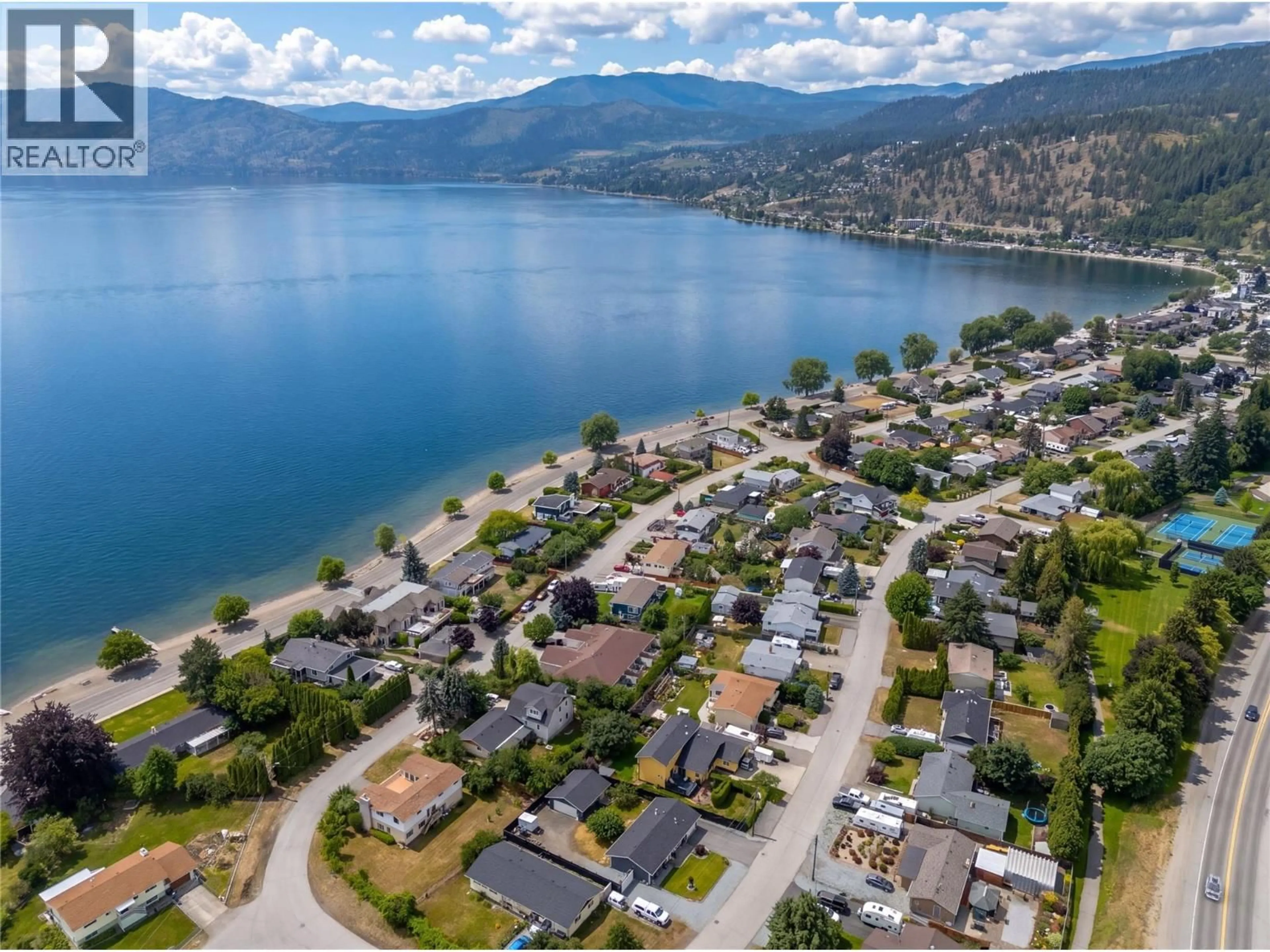 A pic from outside/outdoor area/front of a property/back of a property/a pic from drone, water/lake/river/ocean view for A - 4032A LAKE AVENUE, Peachland British Columbia V0H1X6