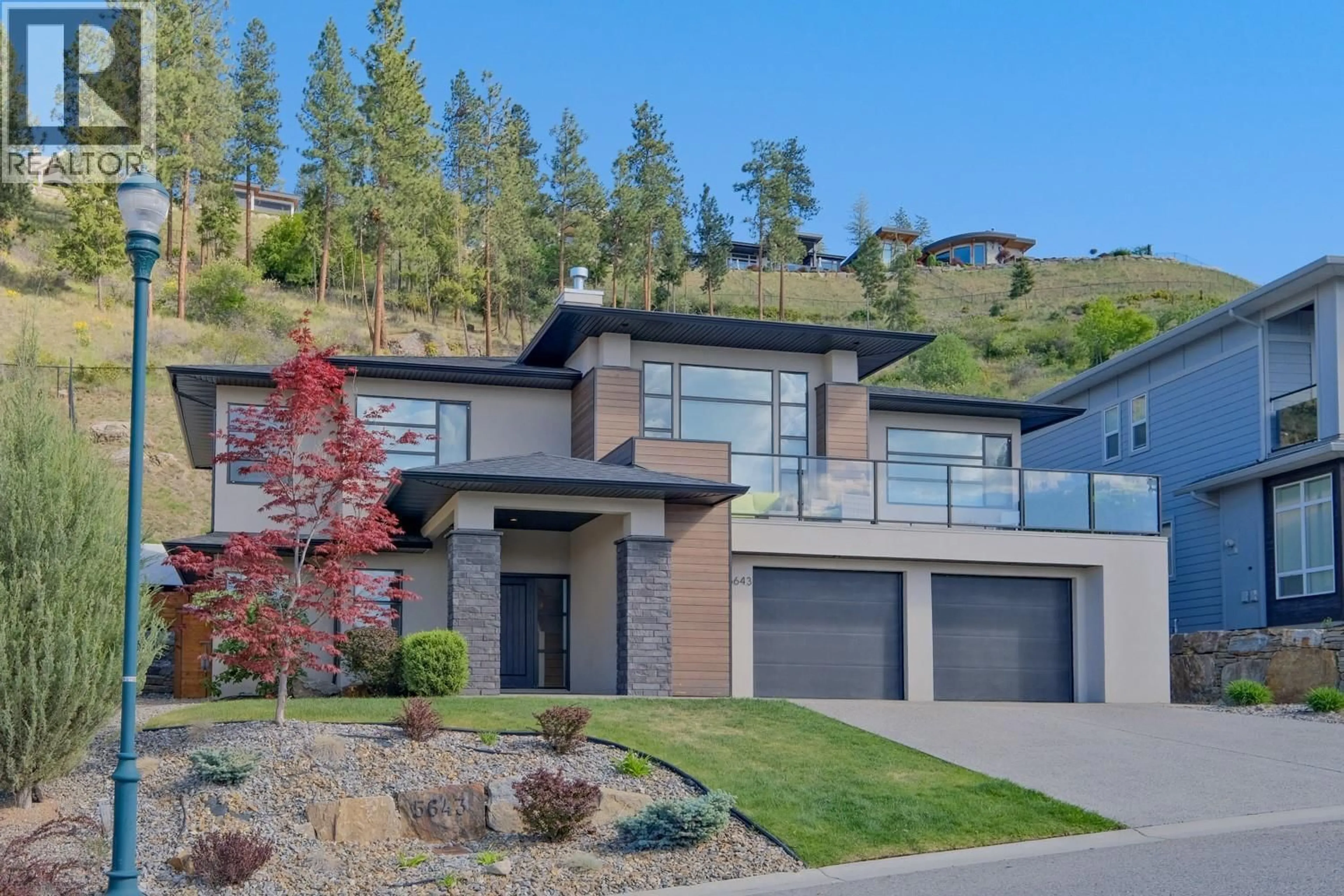 Home with brick exterior material, unknown for 5643 JASPER WAY, Kelowna British Columbia V1W5L7