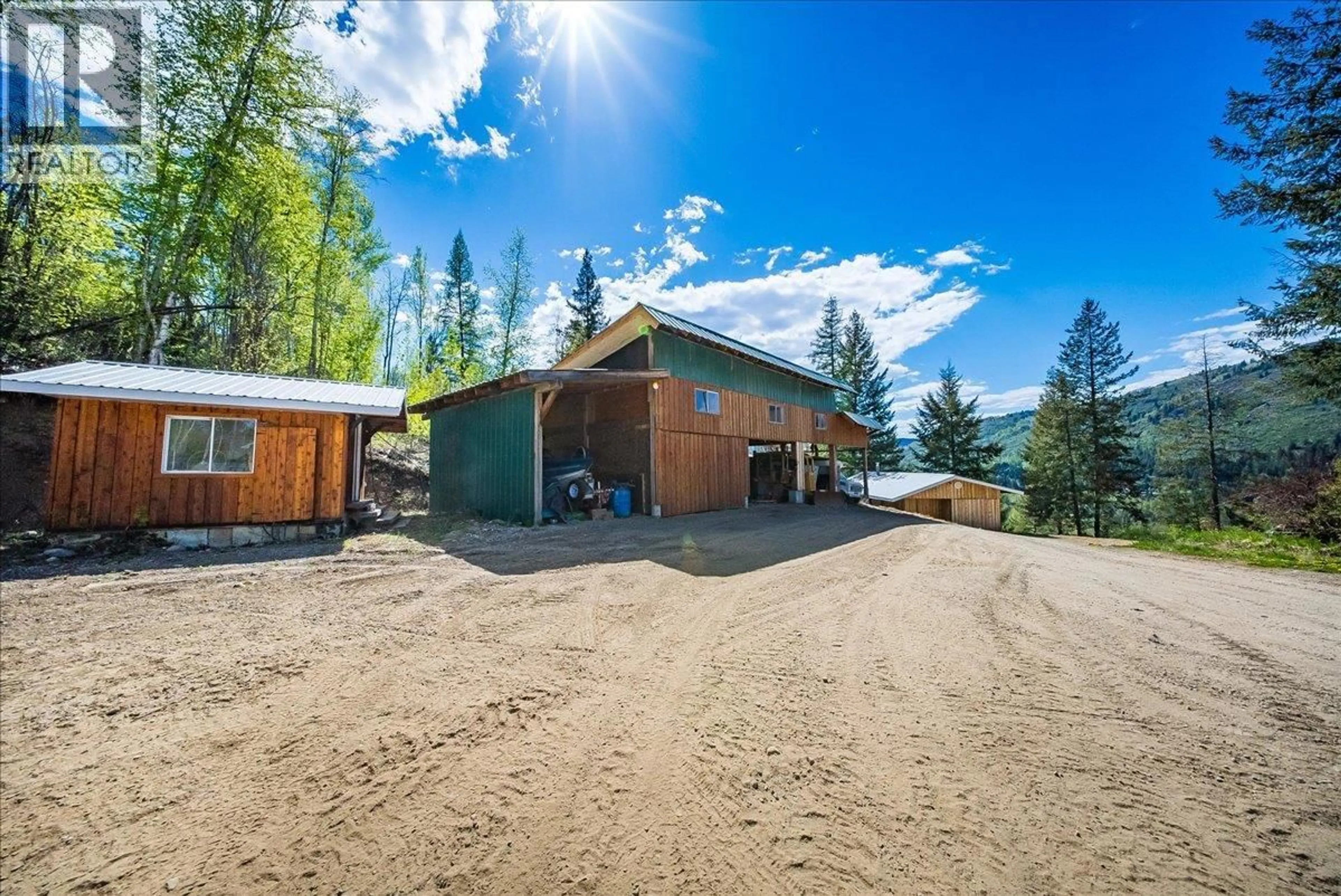 A pic from outside/outdoor area/front of a property/back of a property/a pic from drone, mountain view for 1232 MCLEOD ROAD, Beaver Falls British Columbia V0G1L1