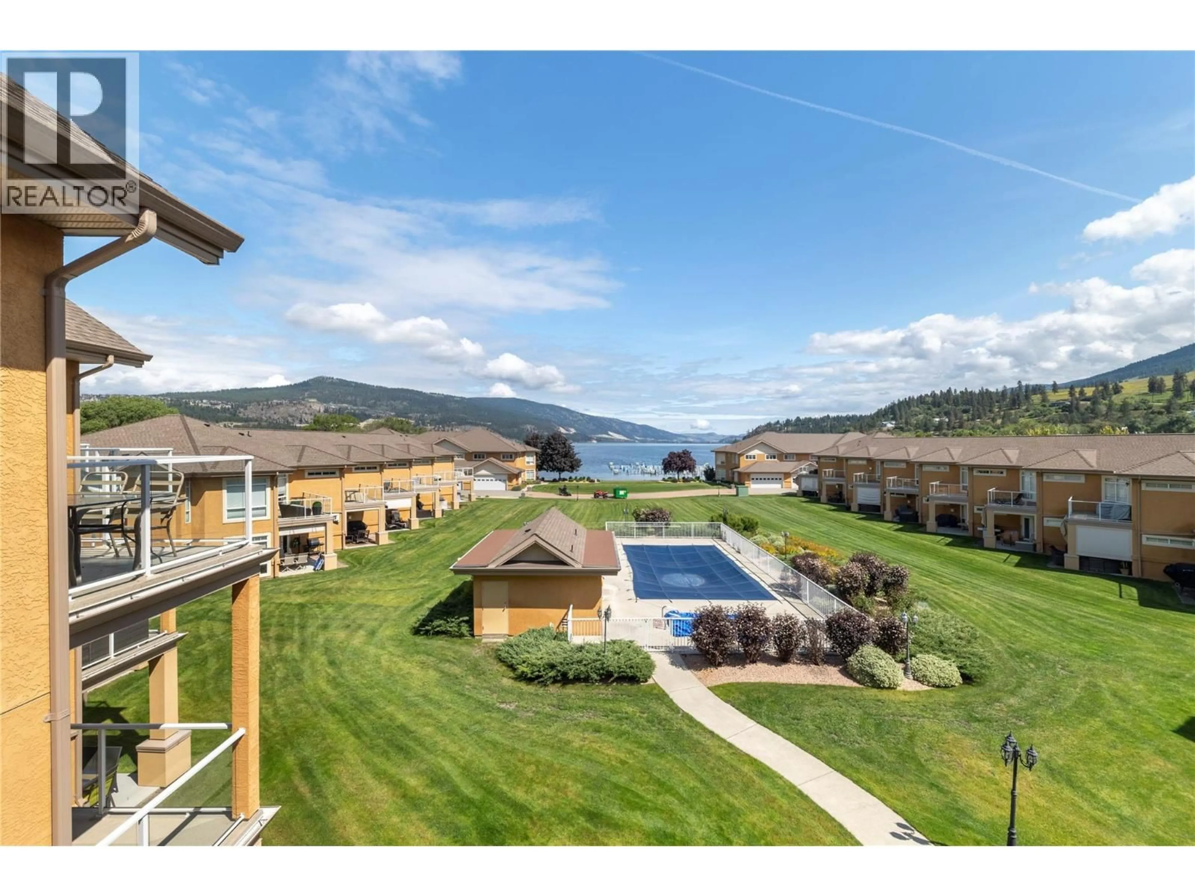 A pic from outside/outdoor area/front of a property/back of a property/a pic from drone, water/lake/river/ocean view for 305 - 3570 WOODSDALE ROAD, Lake Country British Columbia V4V1Y9