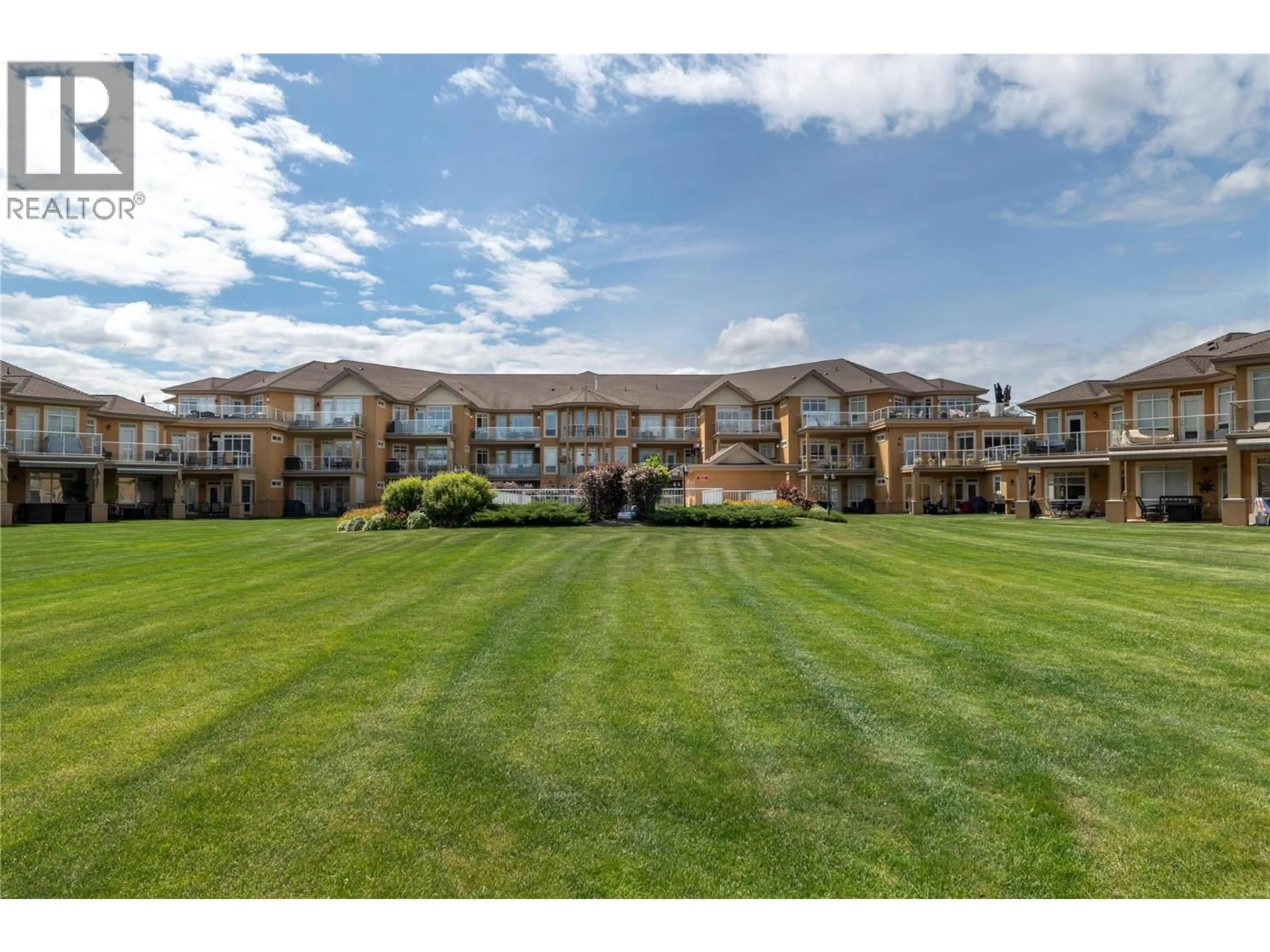A pic from outside/outdoor area/front of a property/back of a property/a pic from drone, water/lake/river/ocean view for 305 - 3570 WOODSDALE ROAD, Lake Country British Columbia V4V1Y9
