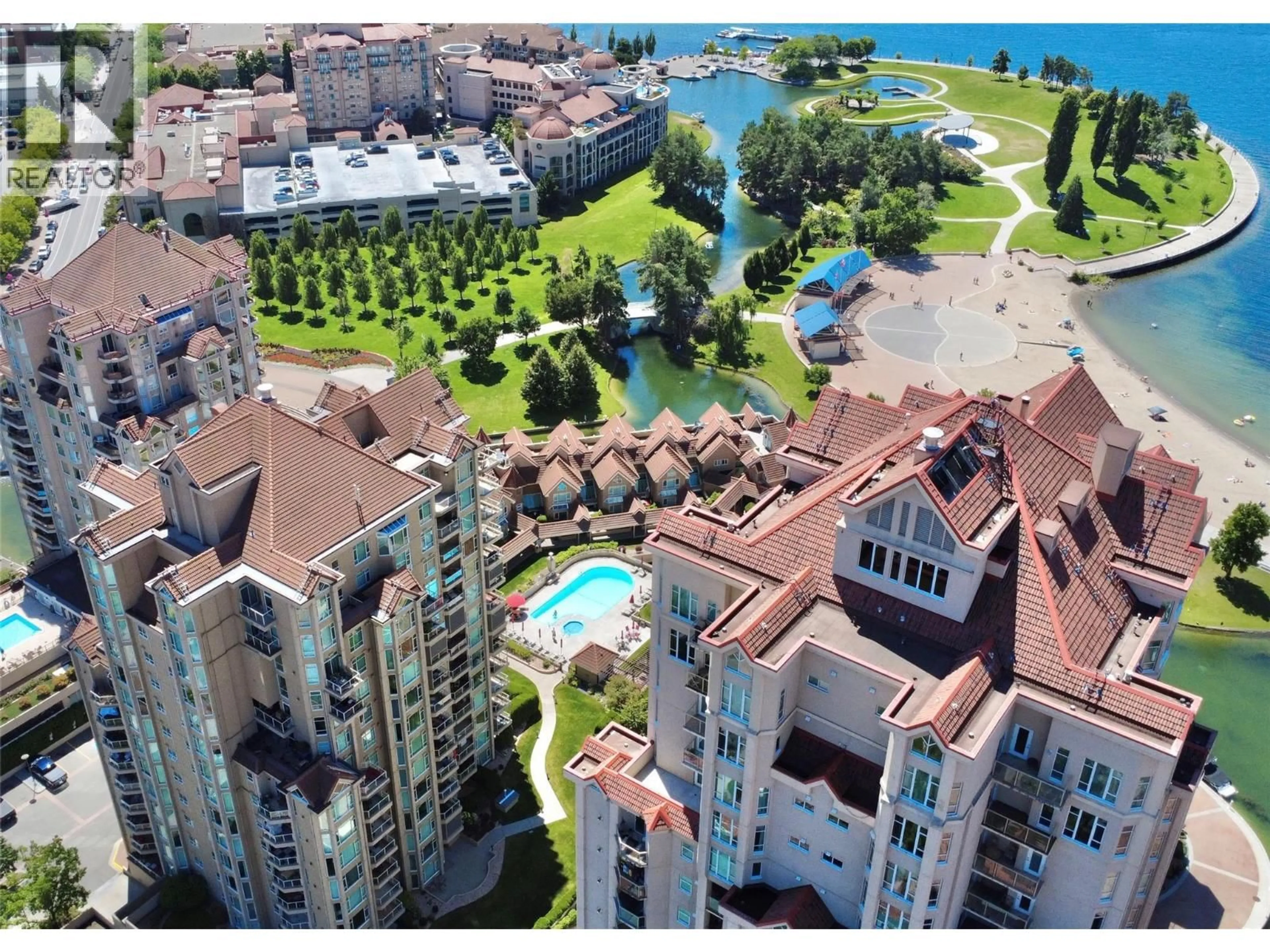 A pic from outside/outdoor area/front of a property/back of a property/a pic from drone, water/lake/river/ocean view for 405 - 1152 SUNSET DRIVE, Kelowna British Columbia V1Y9R7