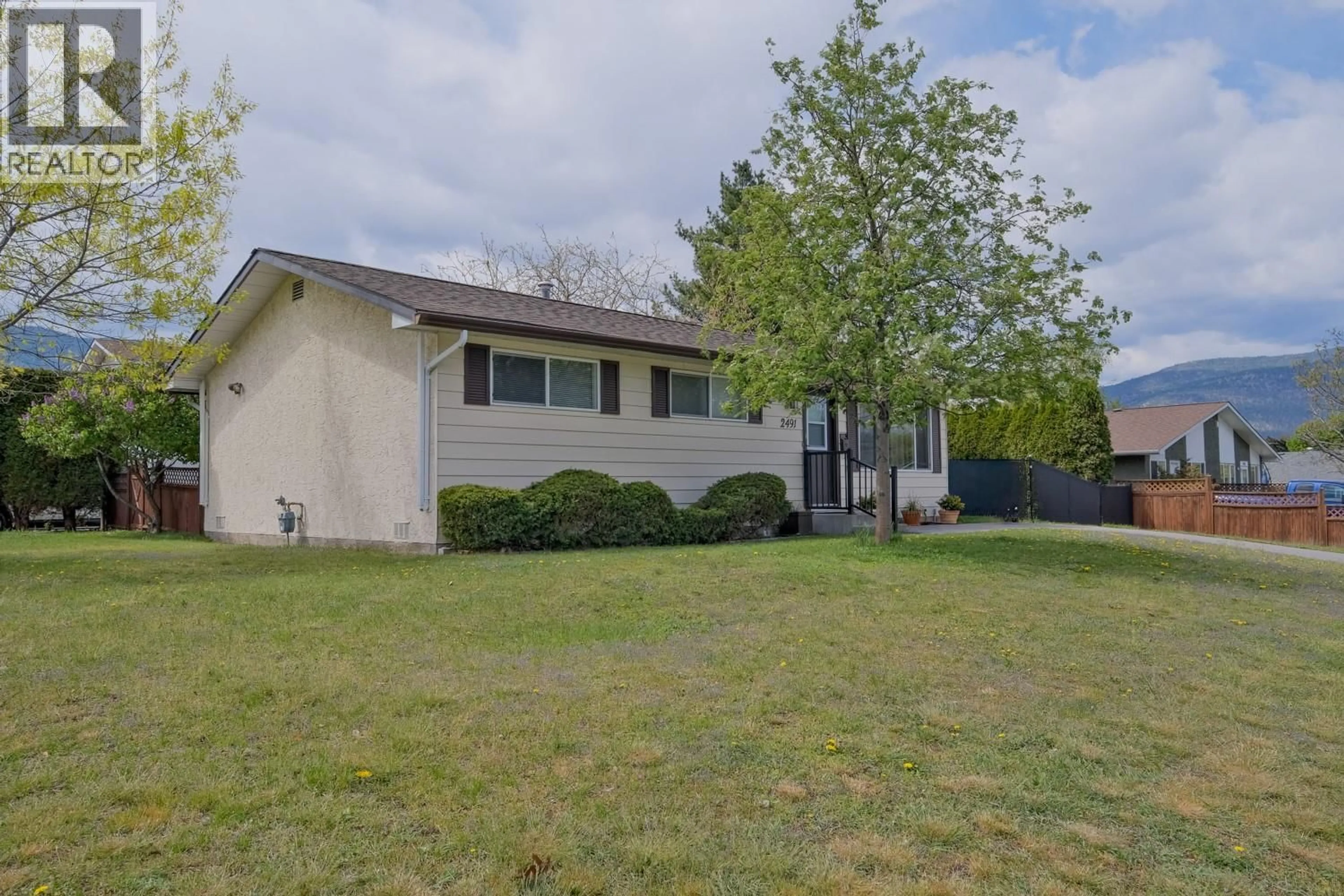 A pic from outside/outdoor area/front of a property/back of a property/a pic from drone, street for 2491 BASKIN STREET, Penticton British Columbia V2A6R1