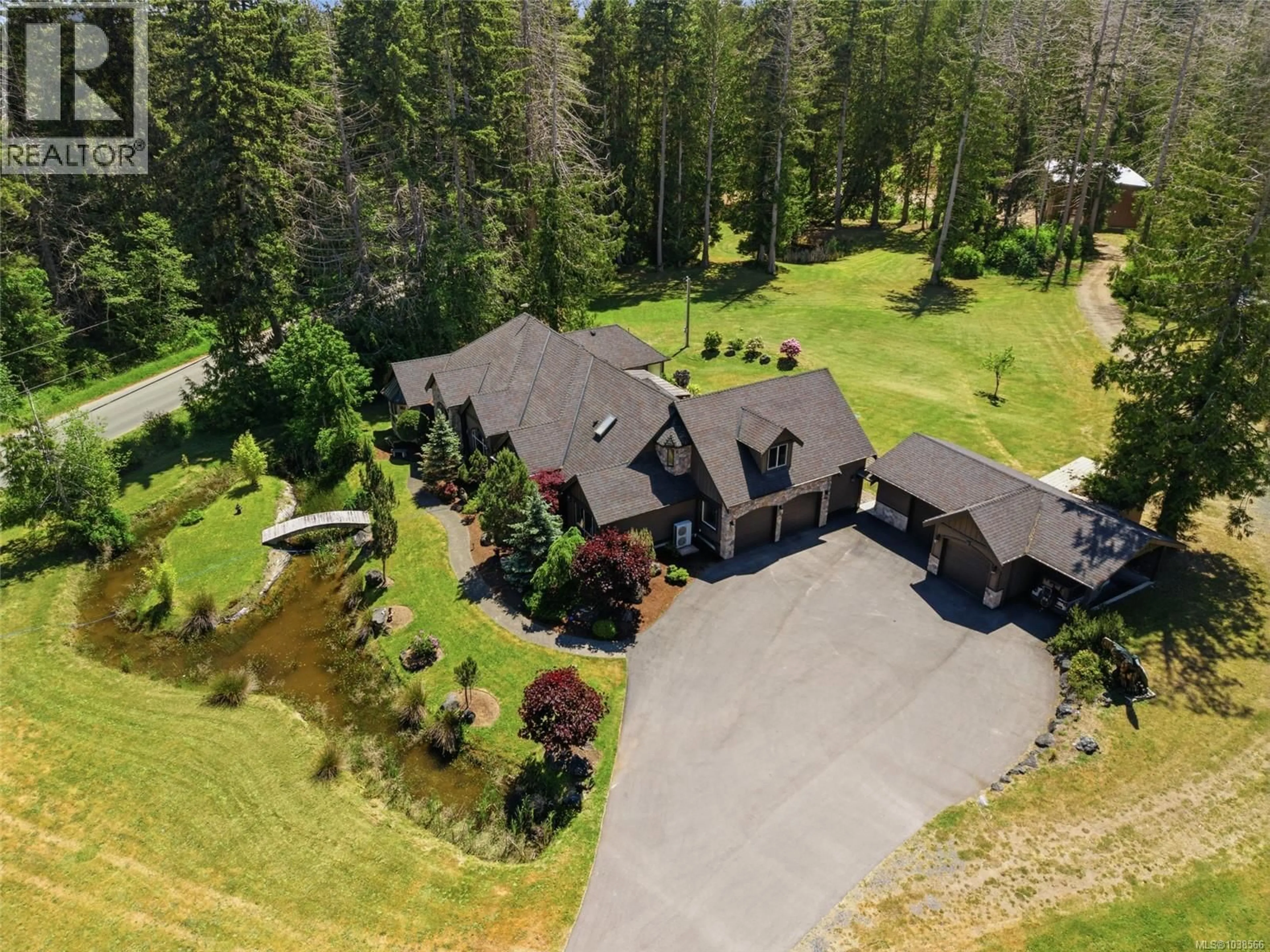 A pic from outside/outdoor area/front of a property/back of a property/a pic from drone, mountain view for 990 VIEW ROAD, Qualicum Beach British Columbia V9K1N3