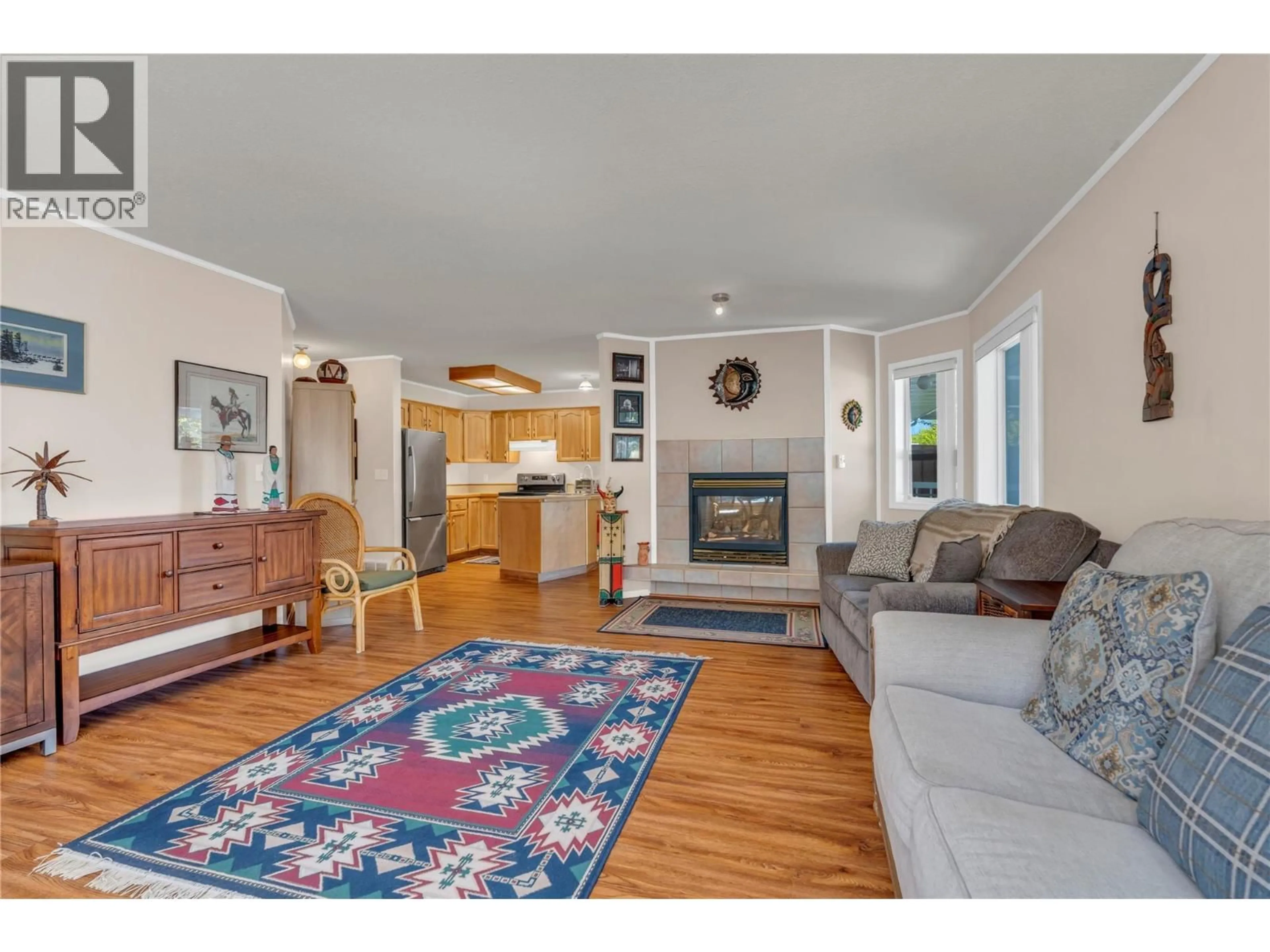 Living room with furniture, wood/laminate floor for 4 - 12606 TEMPLE COURT, Summerland British Columbia V0H1Z4