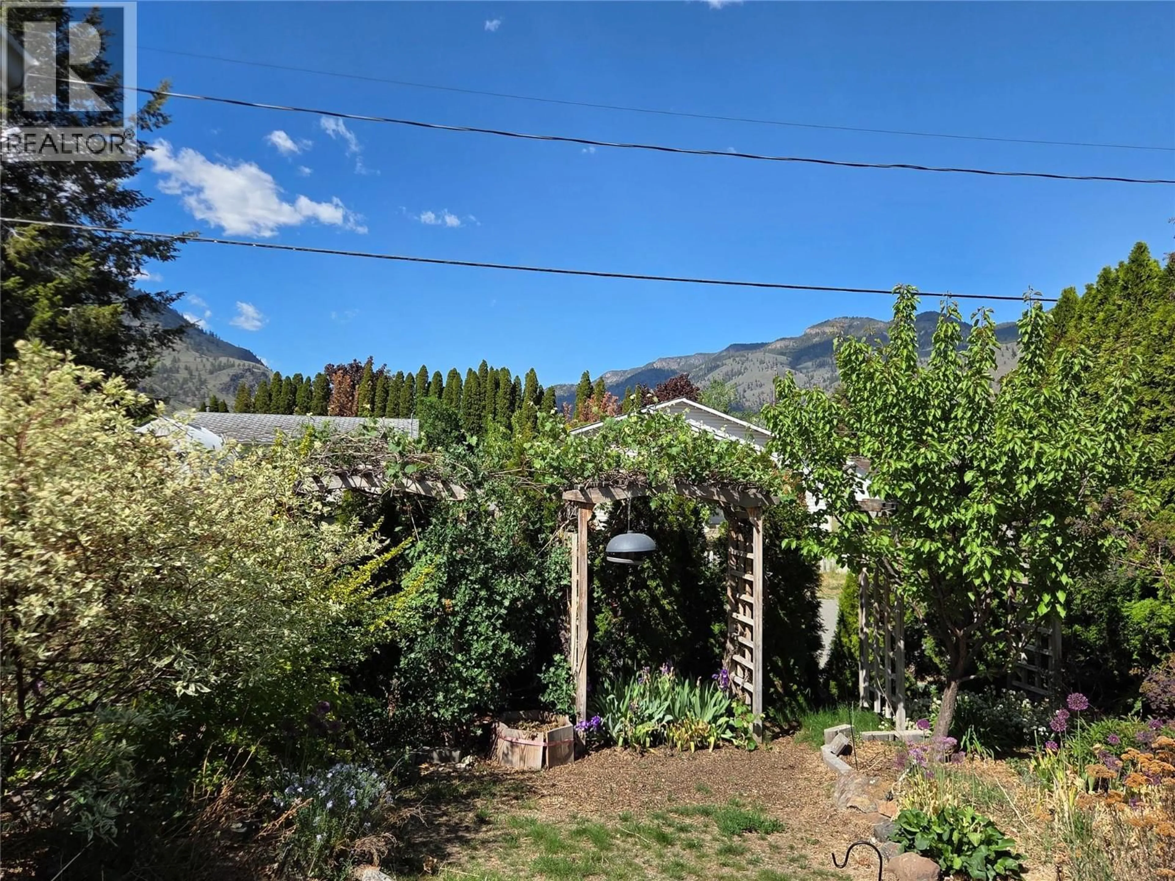 A pic from outside/outdoor area/front of a property/back of a property/a pic from drone, mountain view for 425 3RD AVENUE, Keremeos British Columbia V0X1N2