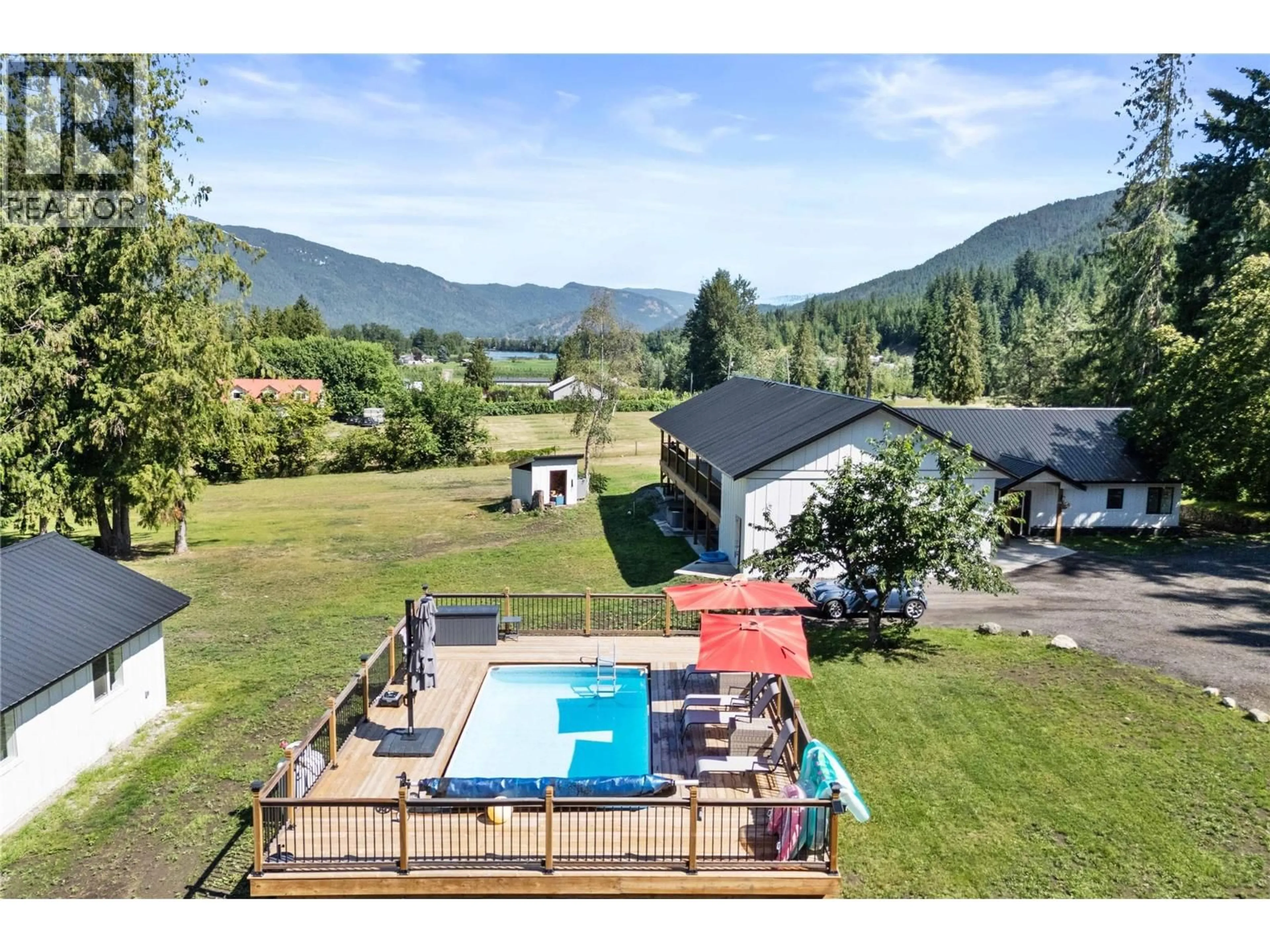 A pic from outside/outdoor area/front of a property/back of a property/a pic from drone, water/lake/river/ocean view for 22 PARSONS ROAD, Mara British Columbia V0E2K0