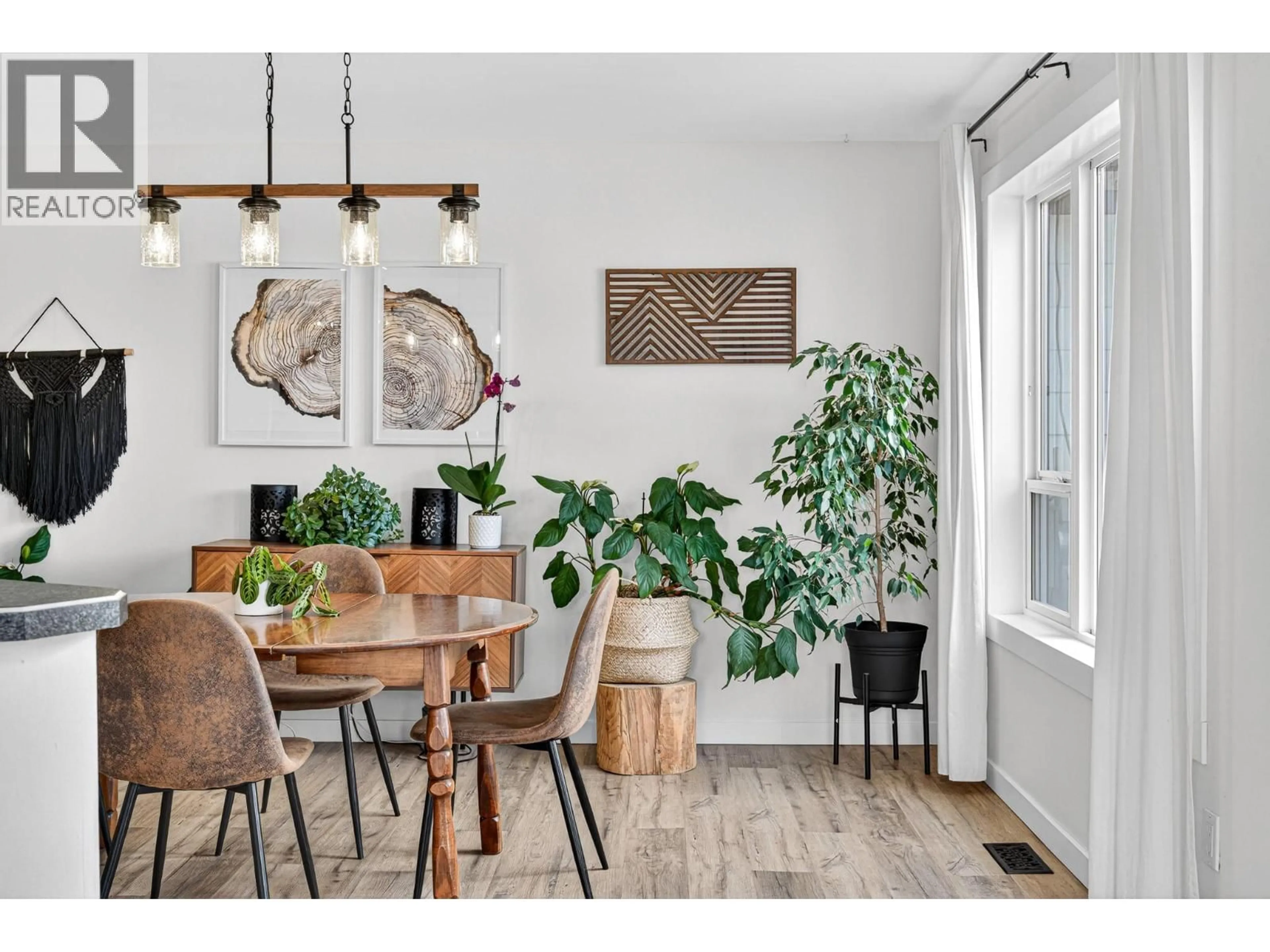 Dining room, wood/laminate floor for 1216 HICKORY CRESCENT, Sparwood British Columbia V0B2G2